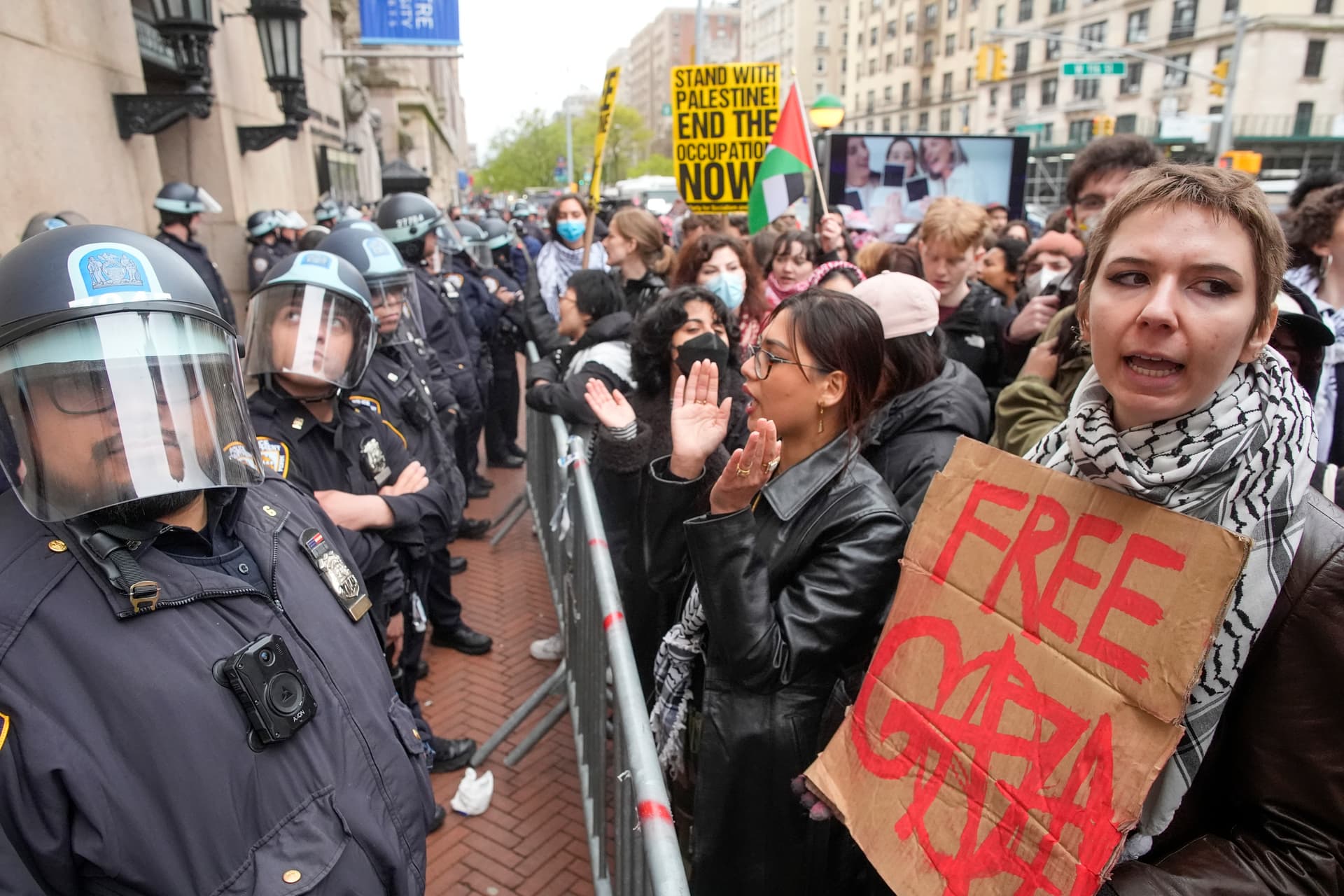 AP Photo/Mary Altaffer, File Police in Riot gear stand guard as demonstrators chant slogans outside the Columbia University campus, on April 18, 2024, in New York.