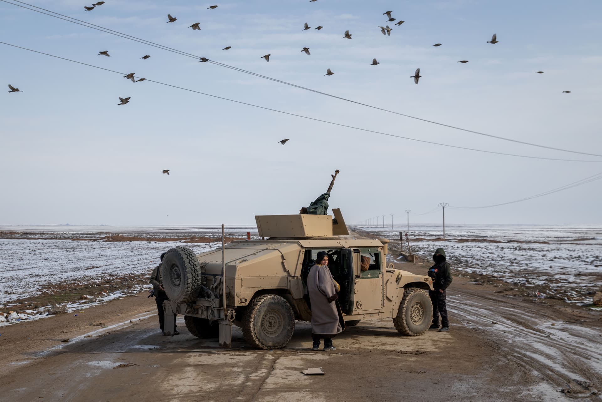 Ethan Swope/Getty Images YPG fighters operate near a frontline position January 24, 2026 in Al Hasakah, Syria.
