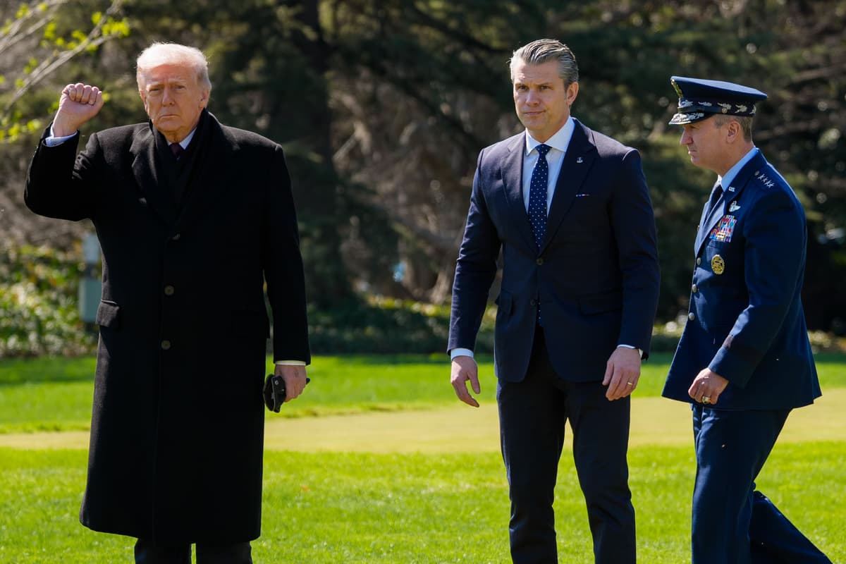 Andrew Harnik/Getty Images President Trump, accompanied by Secretary of Defense Pete Hegseth, and the chairman of the joint chiefs of staff, General Dan Caine.
