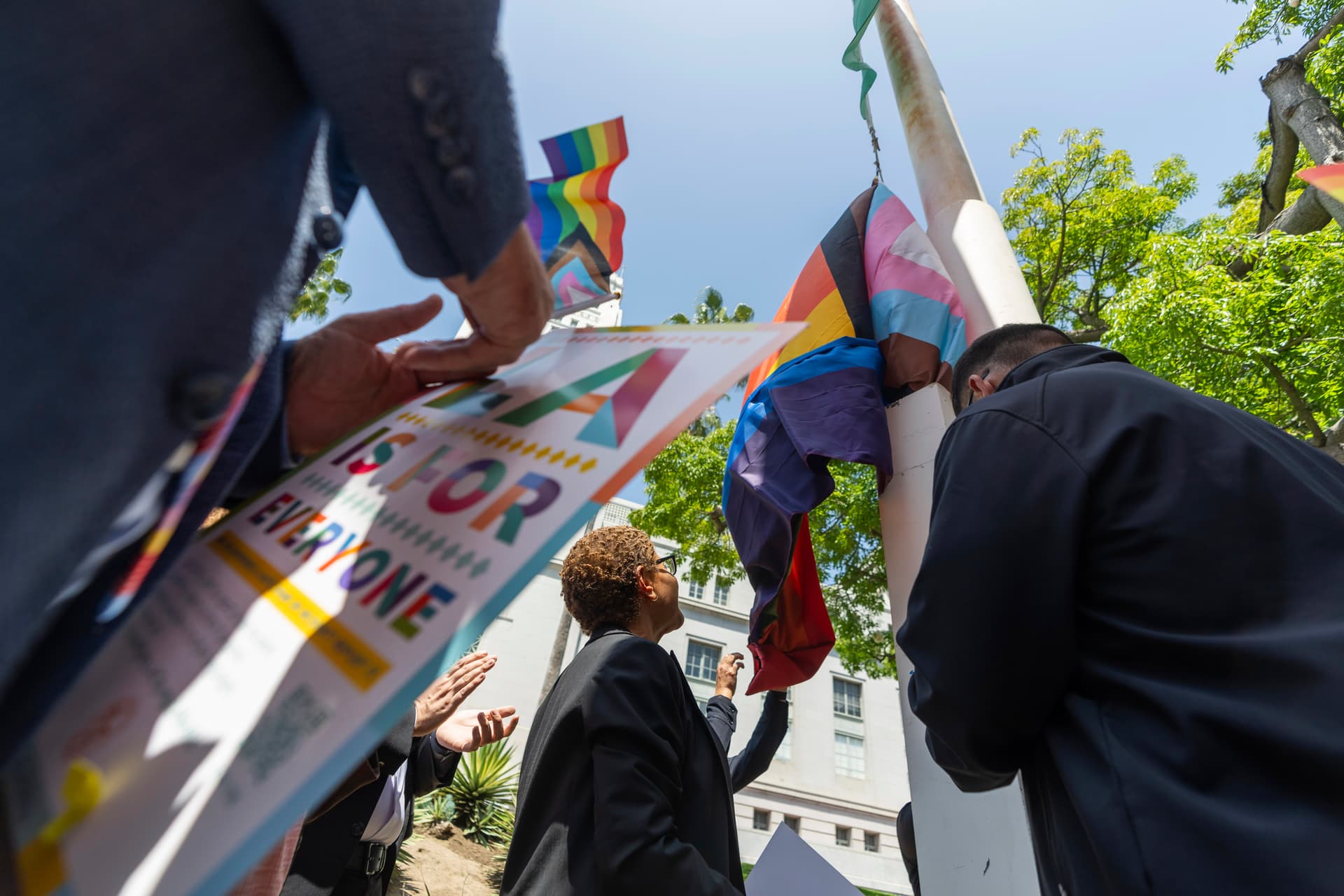 AP/Damian Dovarganes Los Angeles Mayor Karen Bass, center, joins a ceremony flying the LGBTQ+ Pride Flag during the month of Pride outside Los Angeles City Hall, June 6, 2024.