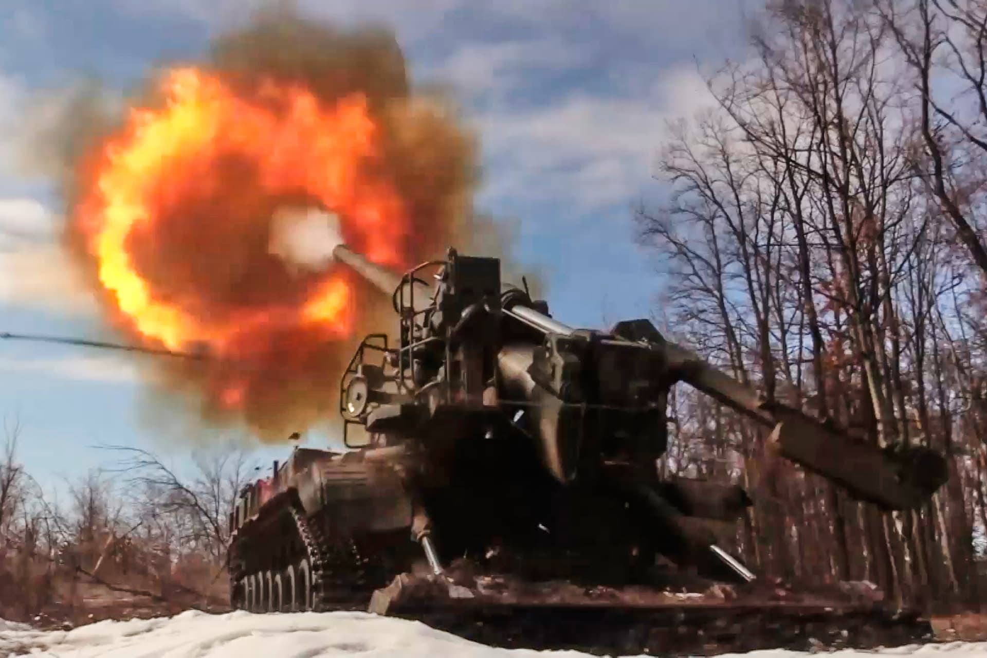 Russian Defense Ministry Press Service via AP A Russian Pion self-propelled 203 mm cannon fires towards a Ukrainian position on March 23, 2026.