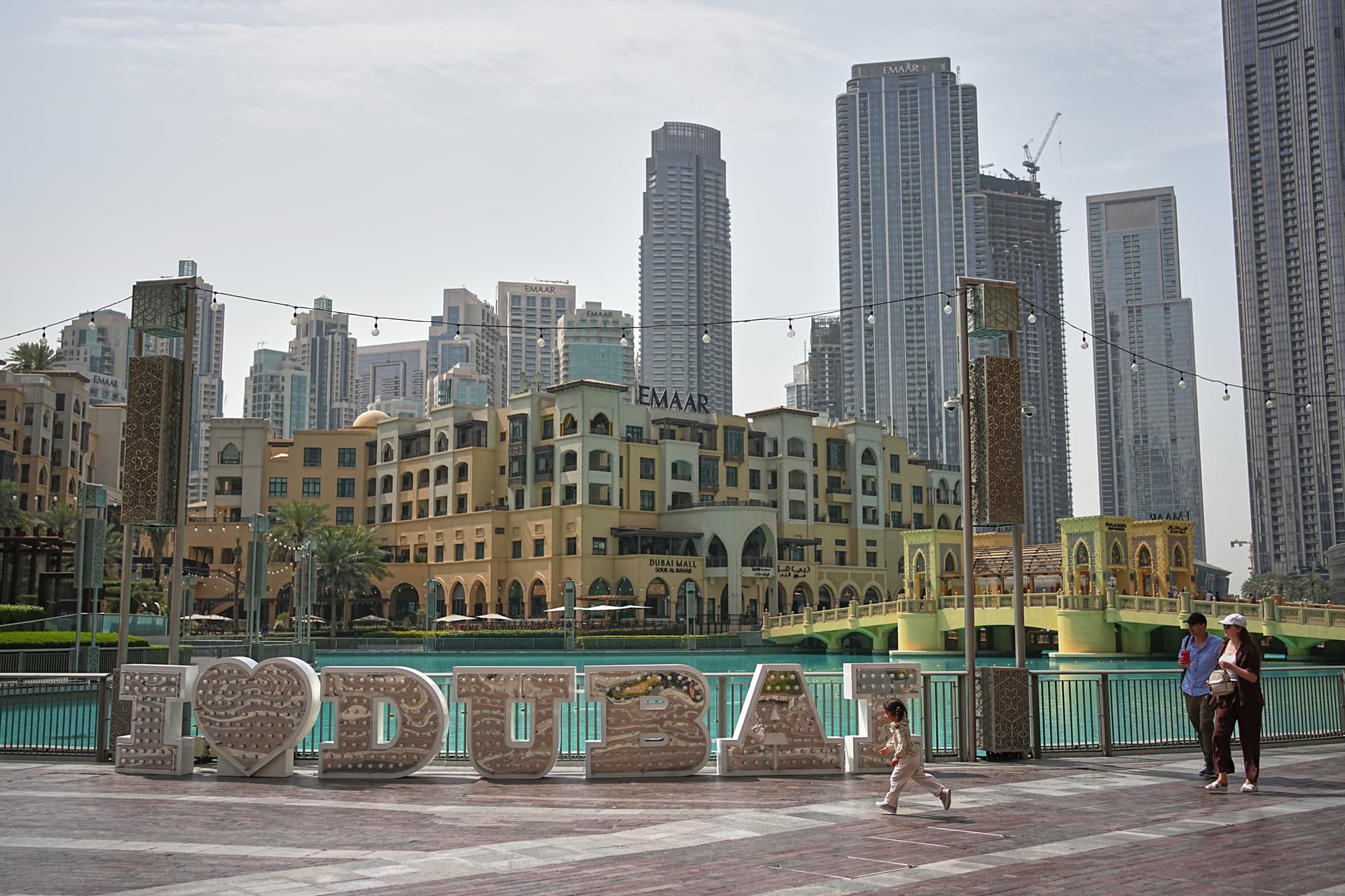 AP/Fatima Shbair People walk in a public plaza in downtown Dubai Tuesday, March 3, 2026.