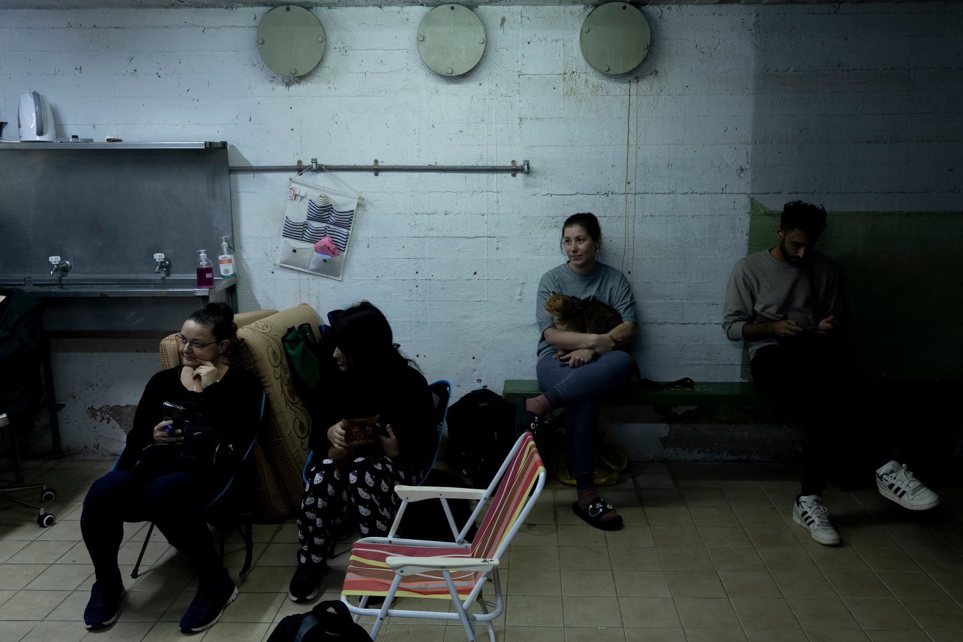 Amir Levy/Getty Images People take a cover in a bomb shelter as a siren warning goes off for incoming ballistic missiles from Iran on March 18, 2026 at Ramat Gan, Israel.