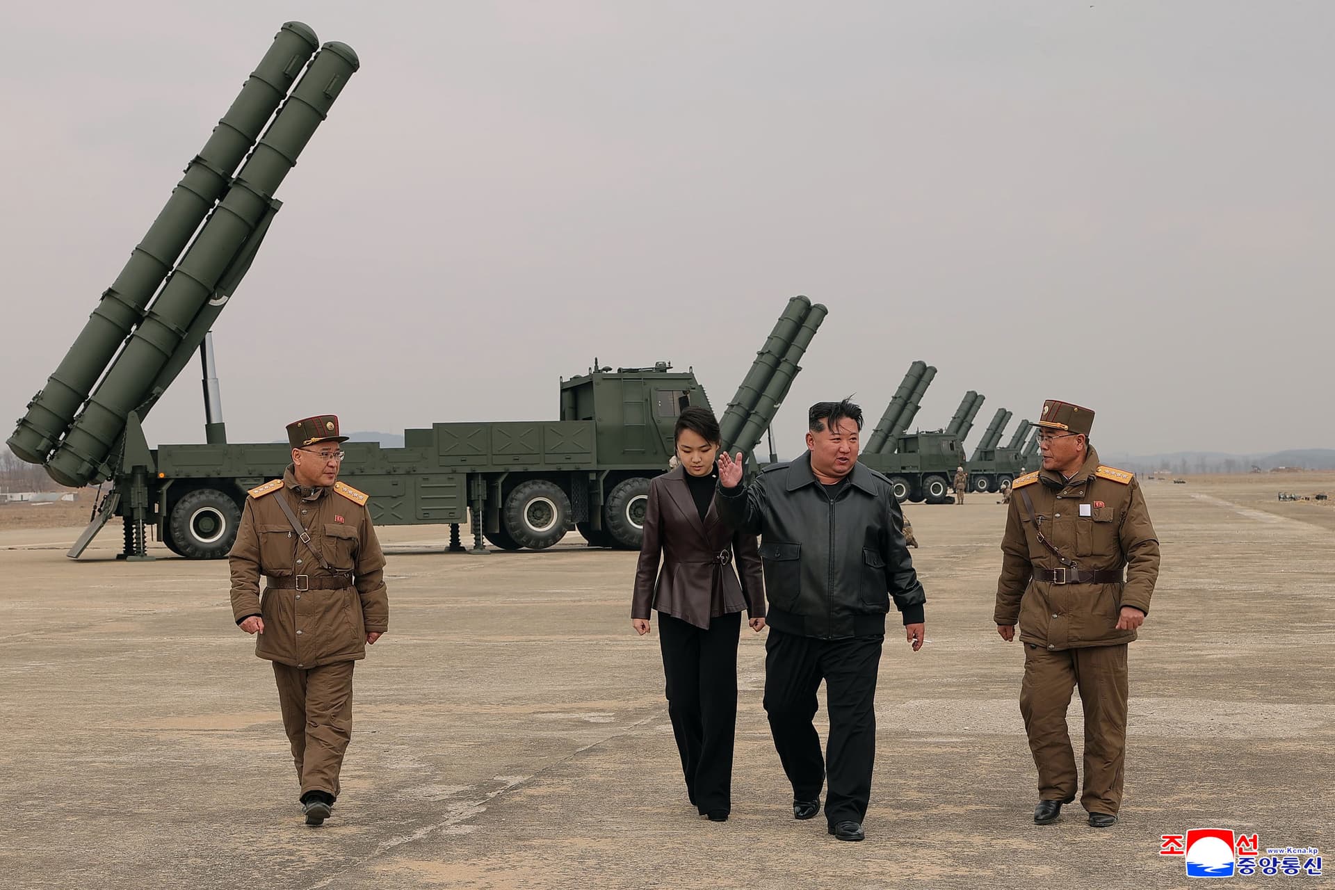 Korean Central News Agency/Korea News Service via AP In this photo provided by the North Korean government, its leader Kim Jong Un, center right, and his daughter, center left, attend a live-fire test of multiple rocket launch systems.