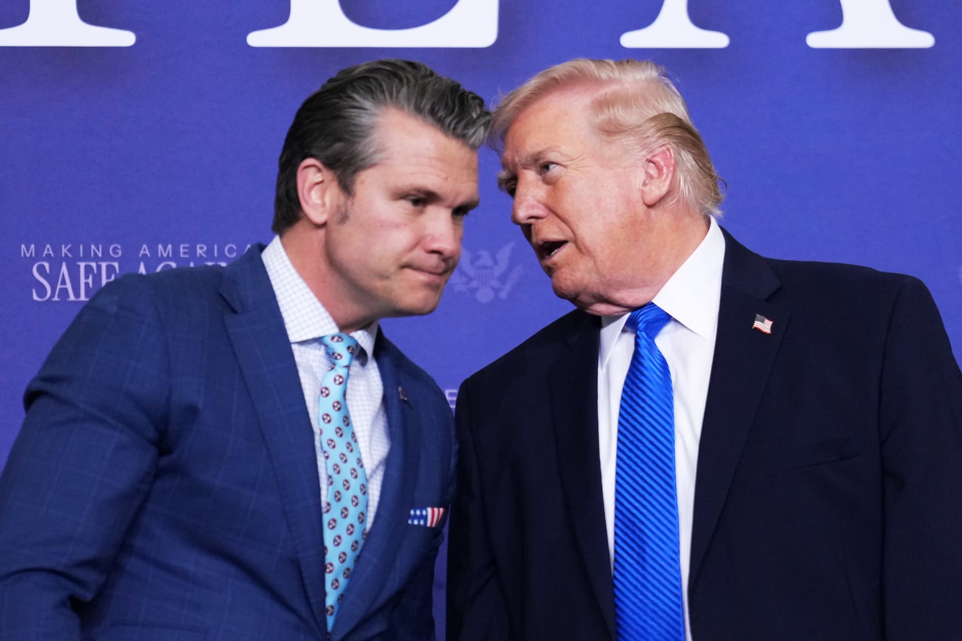 AP/Mark Schiefelbein President Trump speaks with Defense Secretary Pete Hegseth at a Tennessee Air National Guard Base on March 23, 2026 at Memphis.