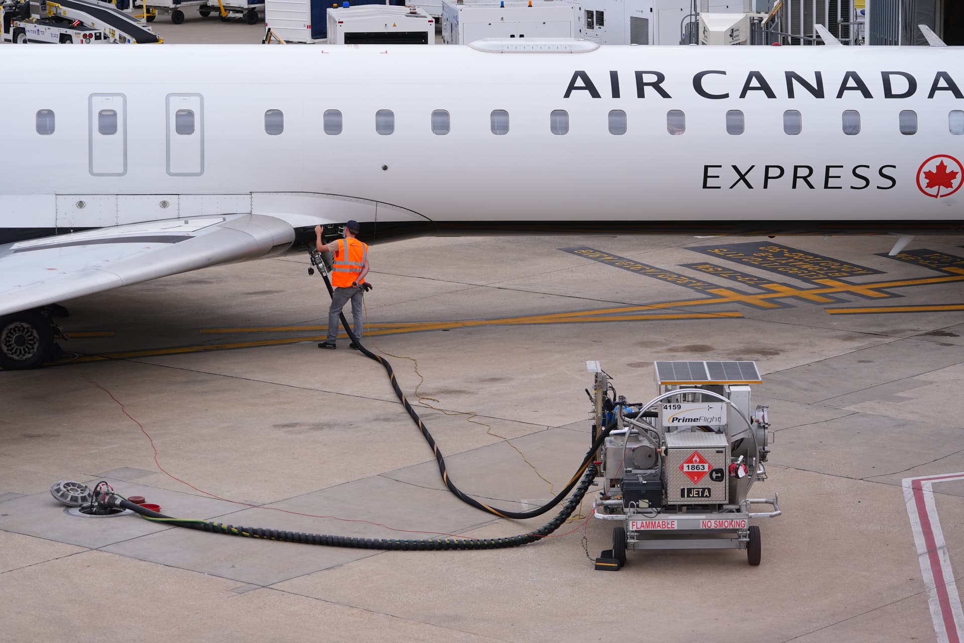 LM Otero/AP A worker fuels an Air Canada jet at Dallas-Fort Worth International Airport at Grapevine, Texas, on April 14, 2026.