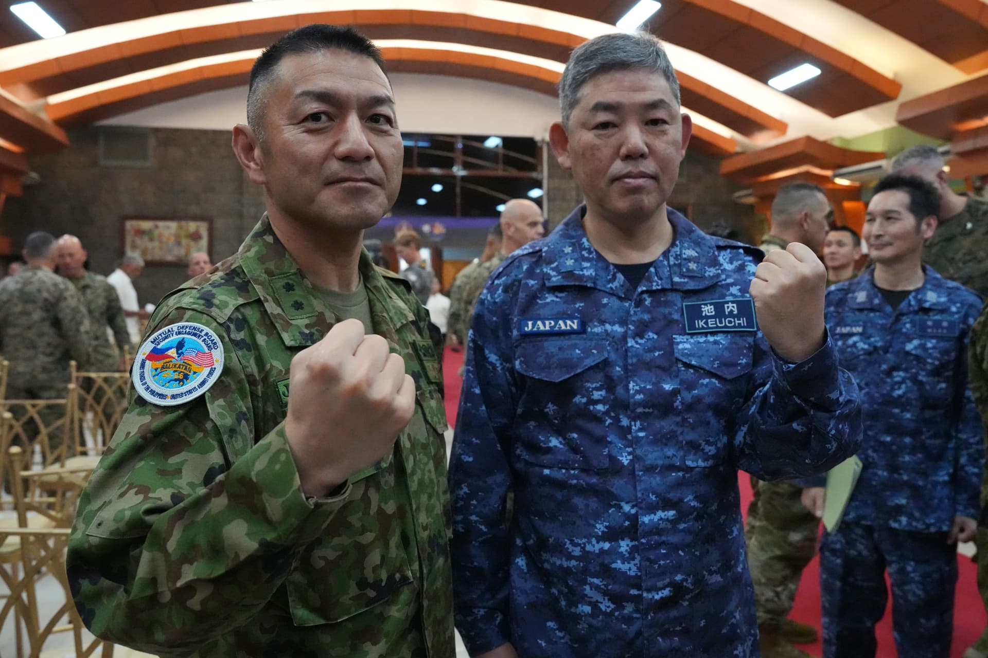 Aaron Favila/AP Major General Toshikatsu Musha, left, and Rear Admiral Izuru Ikeuchi of the Japanese army and navy pose during the opening ceremonies of the joint military exercise dubbed "Balikatan" or "Shoulder to Shoulder," at Quezon city, Philippines on April 20, 2026.