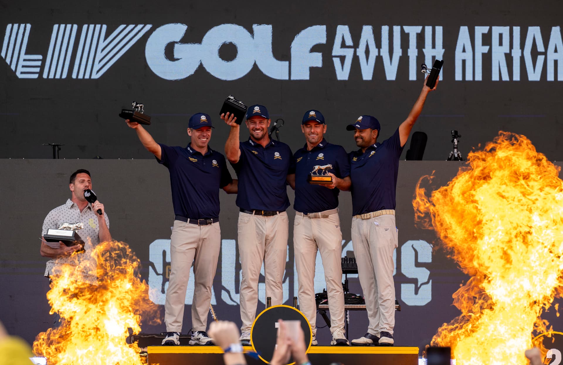 Johan Rynners/Getty Images Bryson DeChambeau (center) and fellow Crushers GC react with trophy during day four of LIV Golf South Africa at The Club at Steyn City on March 22, 2026 in Johannesburg.
