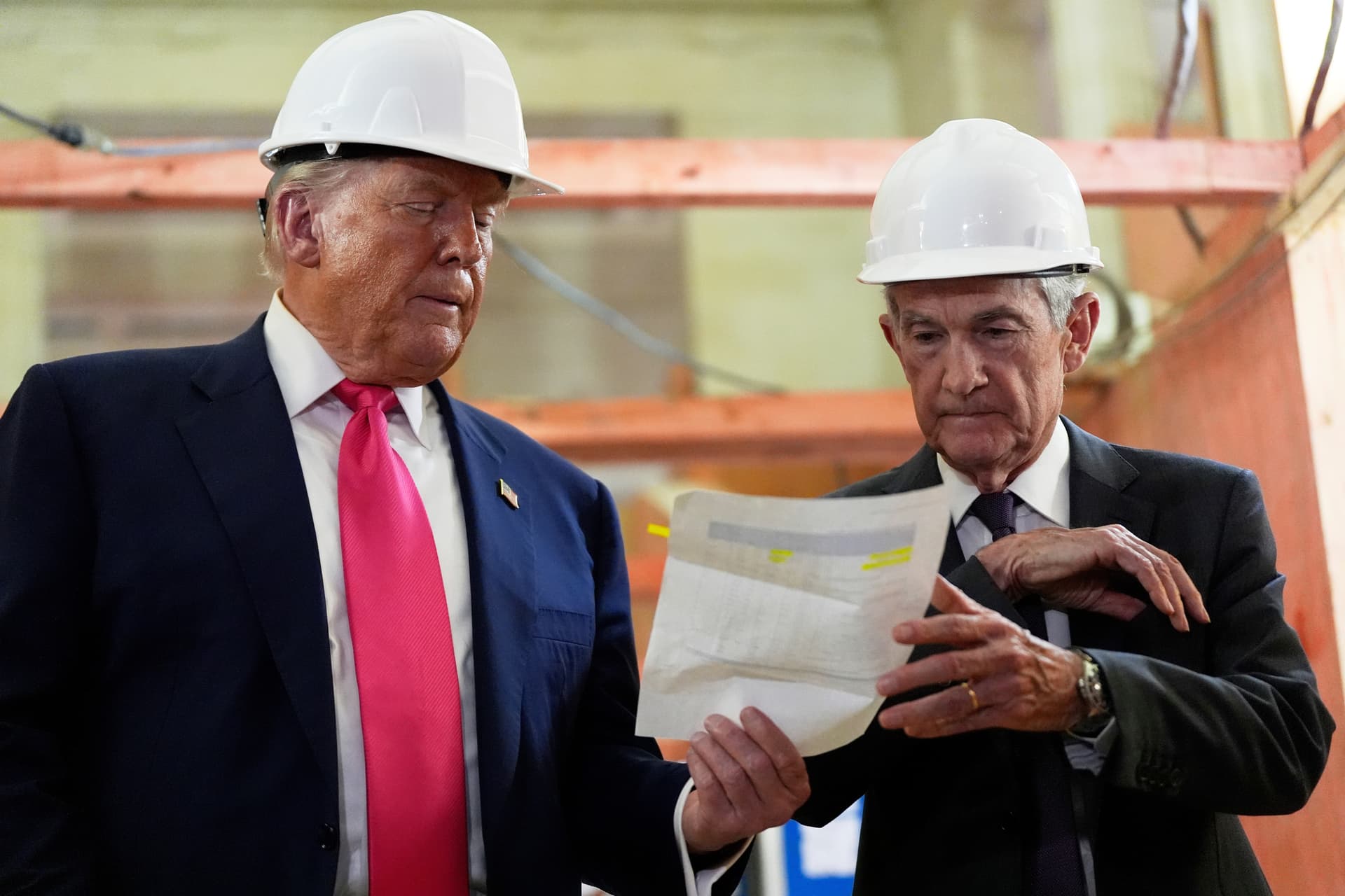 Julia Demaree Nikhinson/AP The Federal Reserve chairman, Jerome Powell, and President Trump look over a document of cost figures during a visit to the Federal Reserve on July 24, 2025.