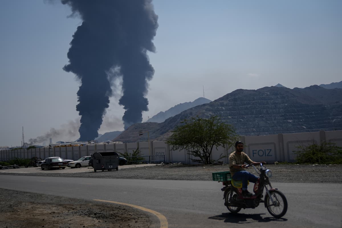 Altaf Qadri/AP Plumes of smoke rise after debris from an intercepted Iranian drone struck an oil facility at Fujairah, United Arab Emirates, on March 14, 2026.