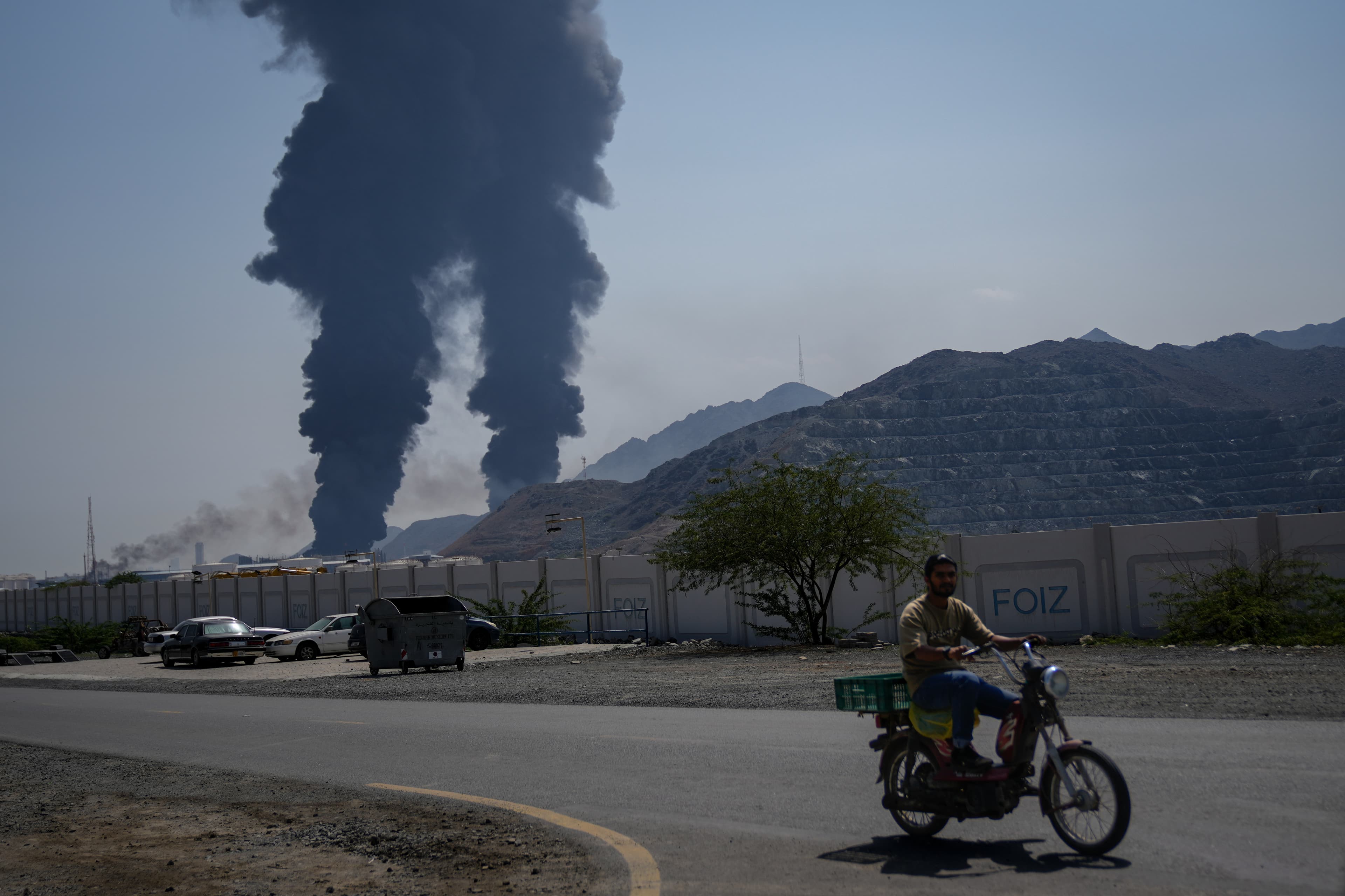 Plumes of smoke rise after debris from an intercepted Iranian drone struck an oil facility at Fujairah, United Arab Emirates, on March 14, 2026. Plumes of smoke rise after debris from an intercepted Iranian drone struck an oil facility at Fujairah, United Arab Emirates, on March 14, 2026.