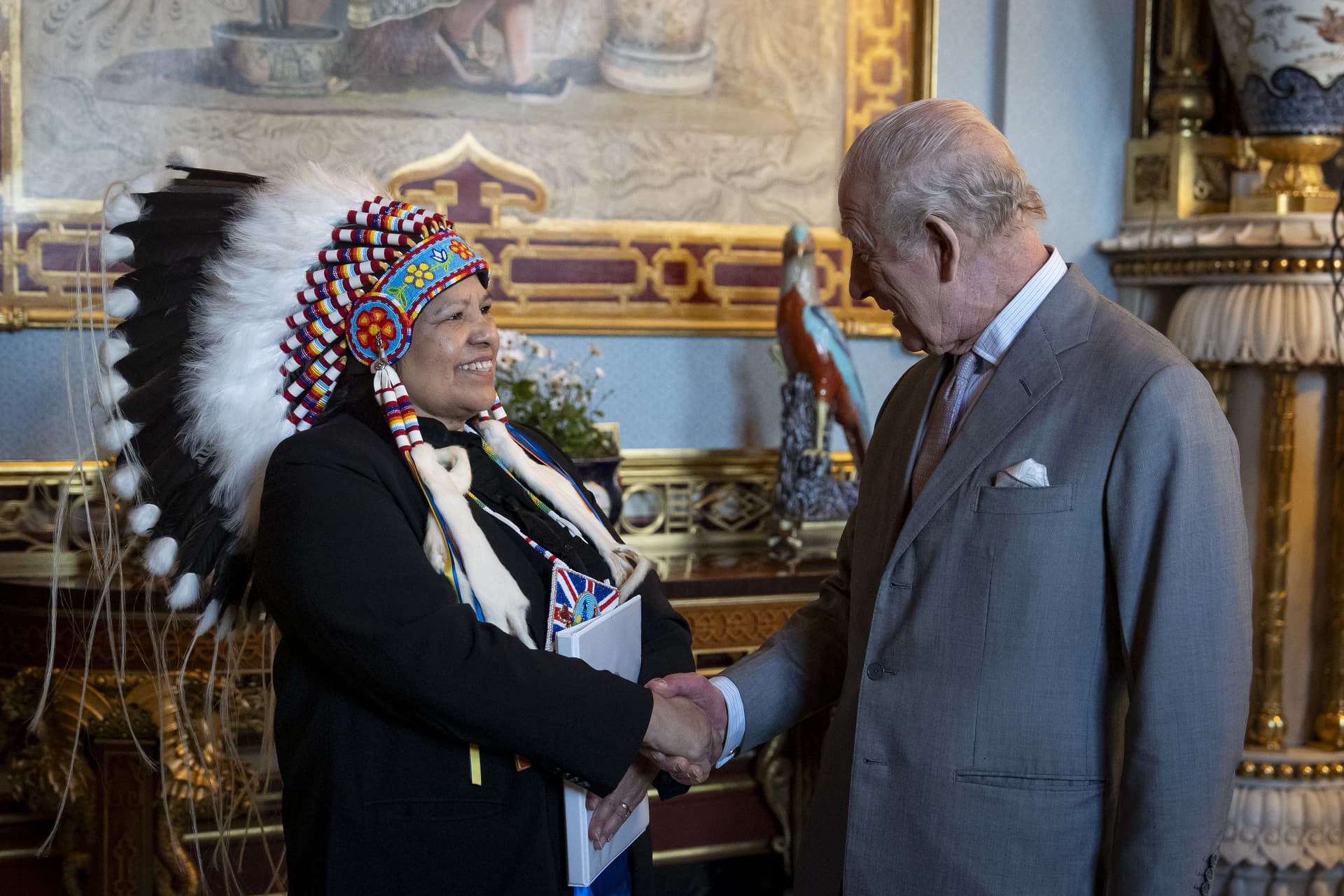 Aaron Chown - WPA pool/Getty Images King Charles III, right, with Chief Christine Longjohn of the Sturgeon Lake First Nation at Buckingham Palace on March 11, 2026.