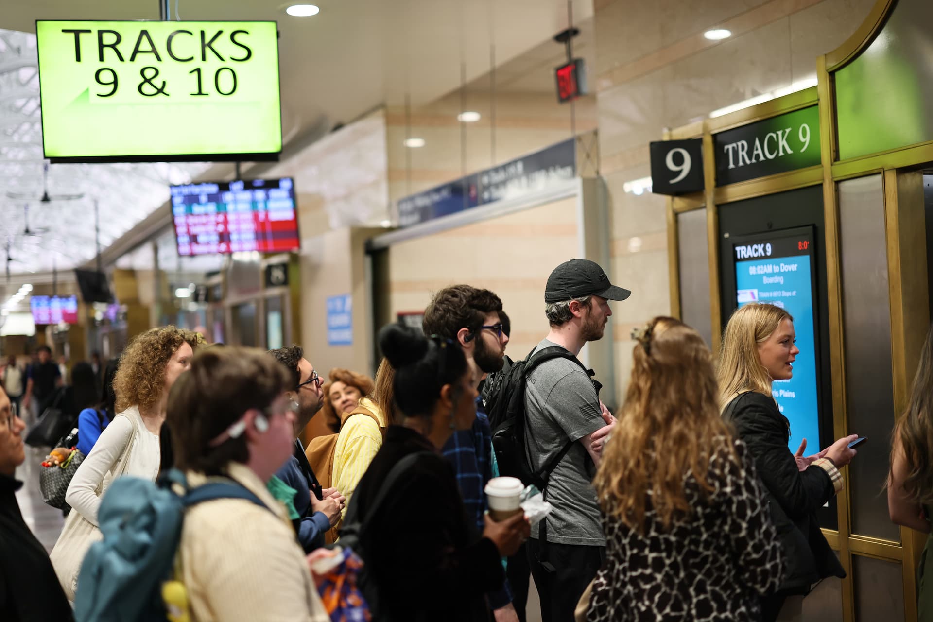 Michael M. Santiago/Getty Images Commuters wait for their train at the NJ Transit section of Penn Station on May 20, 2025 in New York City.