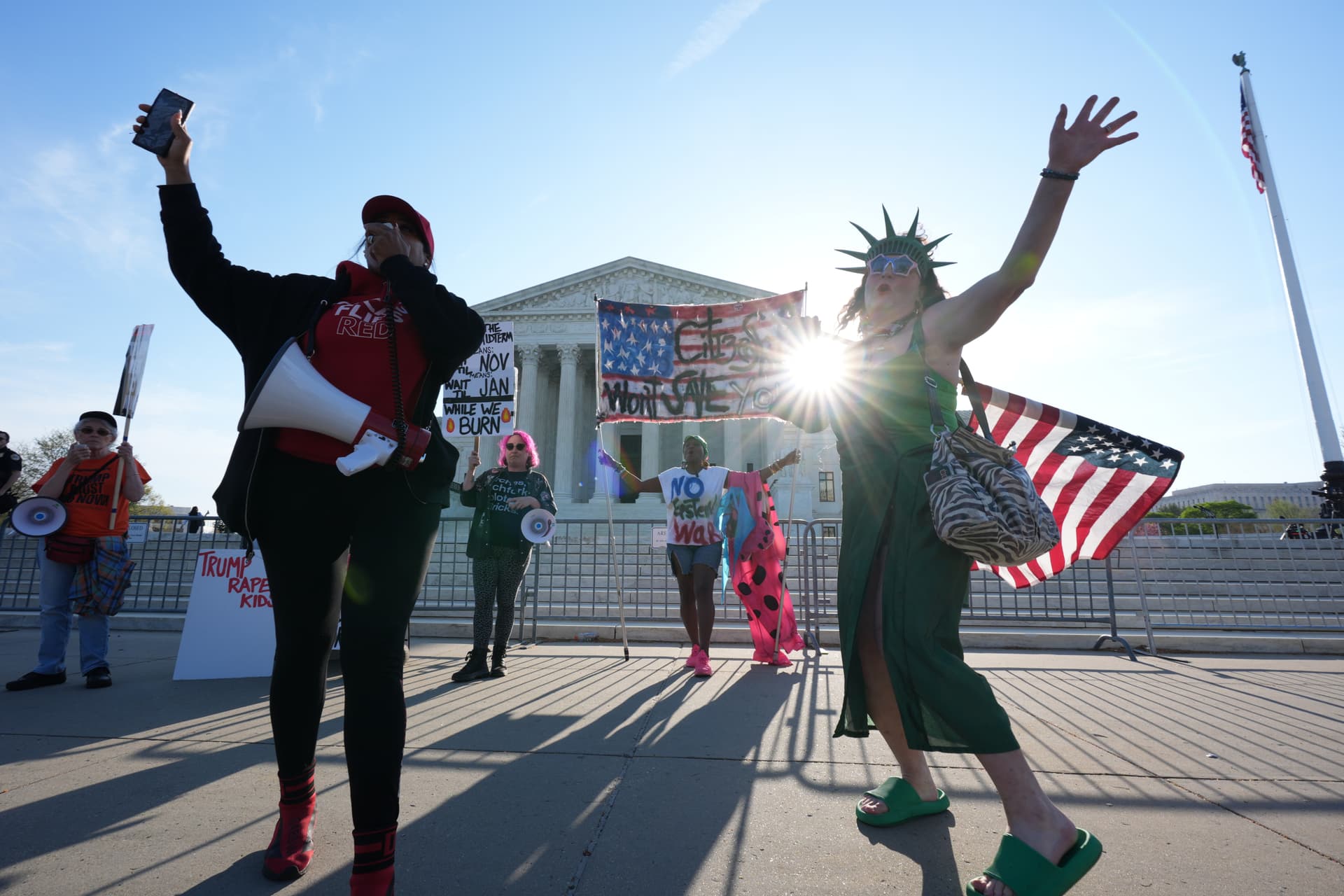 AP/J. Scott Applewhite Pro and anti-Trump demonstrators rally outside the U.S. Supreme Court Wednesday.