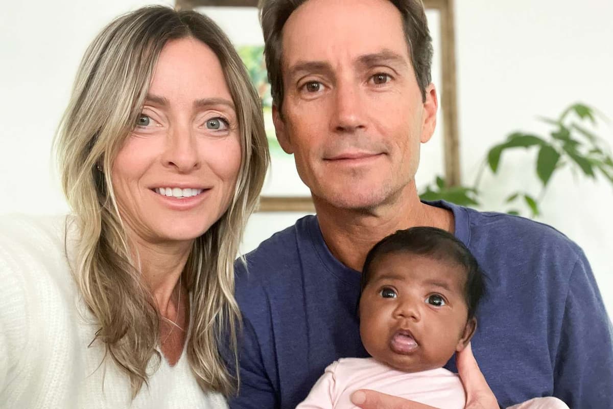 GoFundMe Tiffany Score and Steven Mills are shown with their daughter, Shea, who was born to Tiffany after a fertility clinic transferred the wrong embryo into her during IVF treatments.