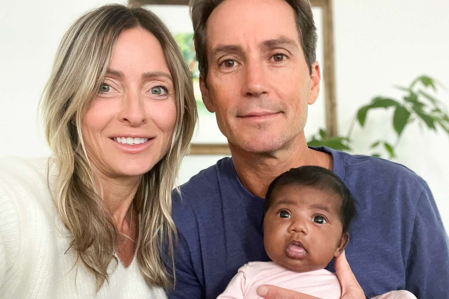 GoFundMe Tiffany Score and Steven Mills are shown with their daughter, Shea, who was born to Tiffany after a fertility clinic transferred the wrong embryo into her during IVF treatments.