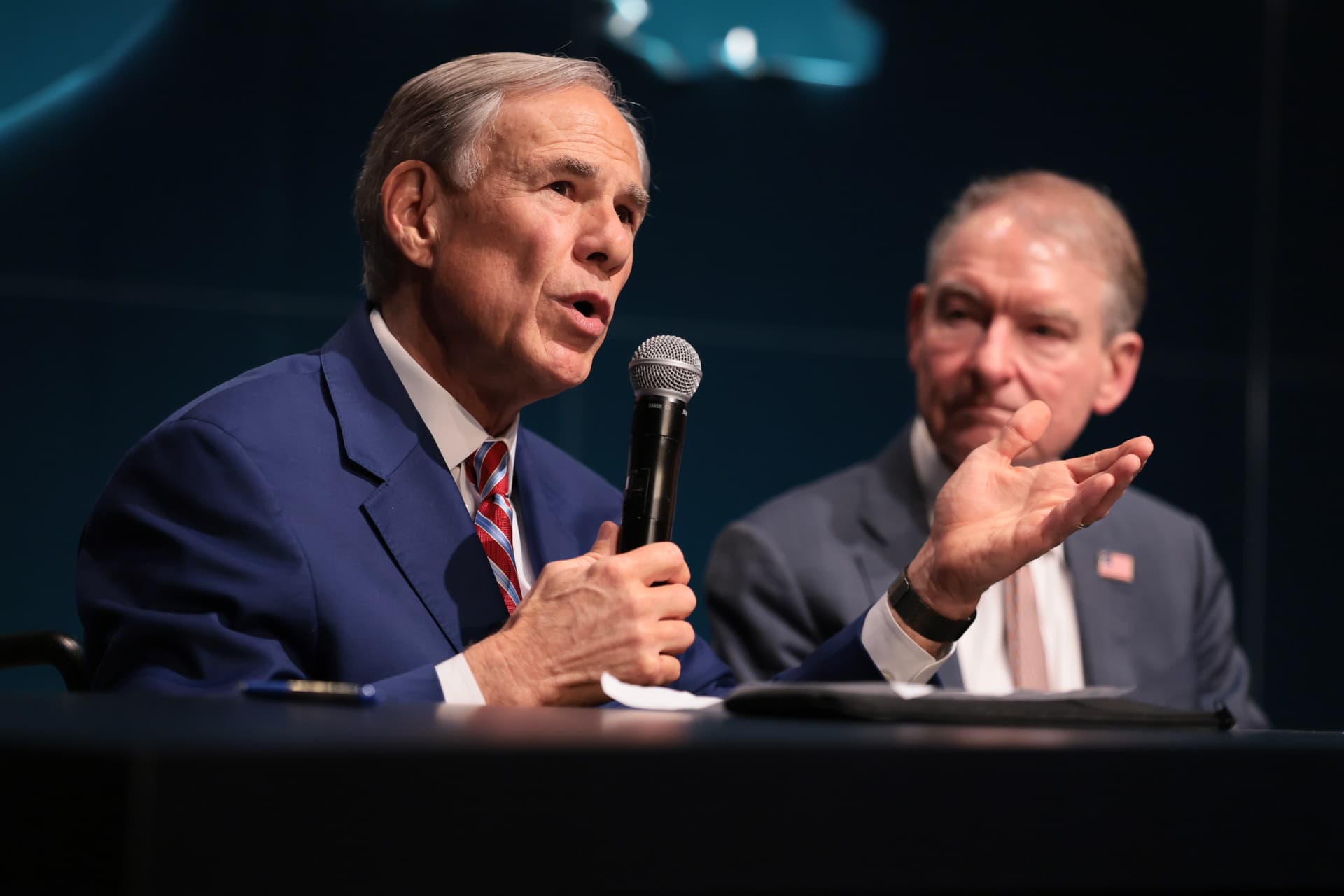 Joe Raedle/Getty Images Governow Greg Abbott and U.S. Securities and Exchange Commission Chairman Paul S. Atkins on April 7, 2026, in Miami, Florida.