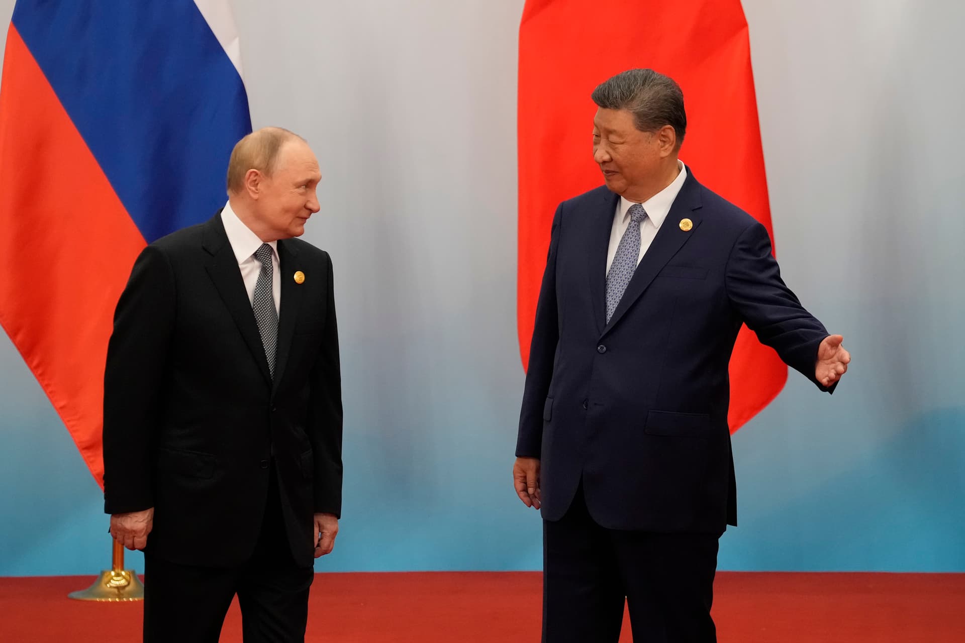 Suo Takekuma/Getty Images President Xi jinping shows the way to President Vladimir Putin during the Shanghai Cooperation Organization (SCO) Summit 2025 at the Meijiang Convention and Exhibition Centre on September 1, 2025 in Tianjin, China.