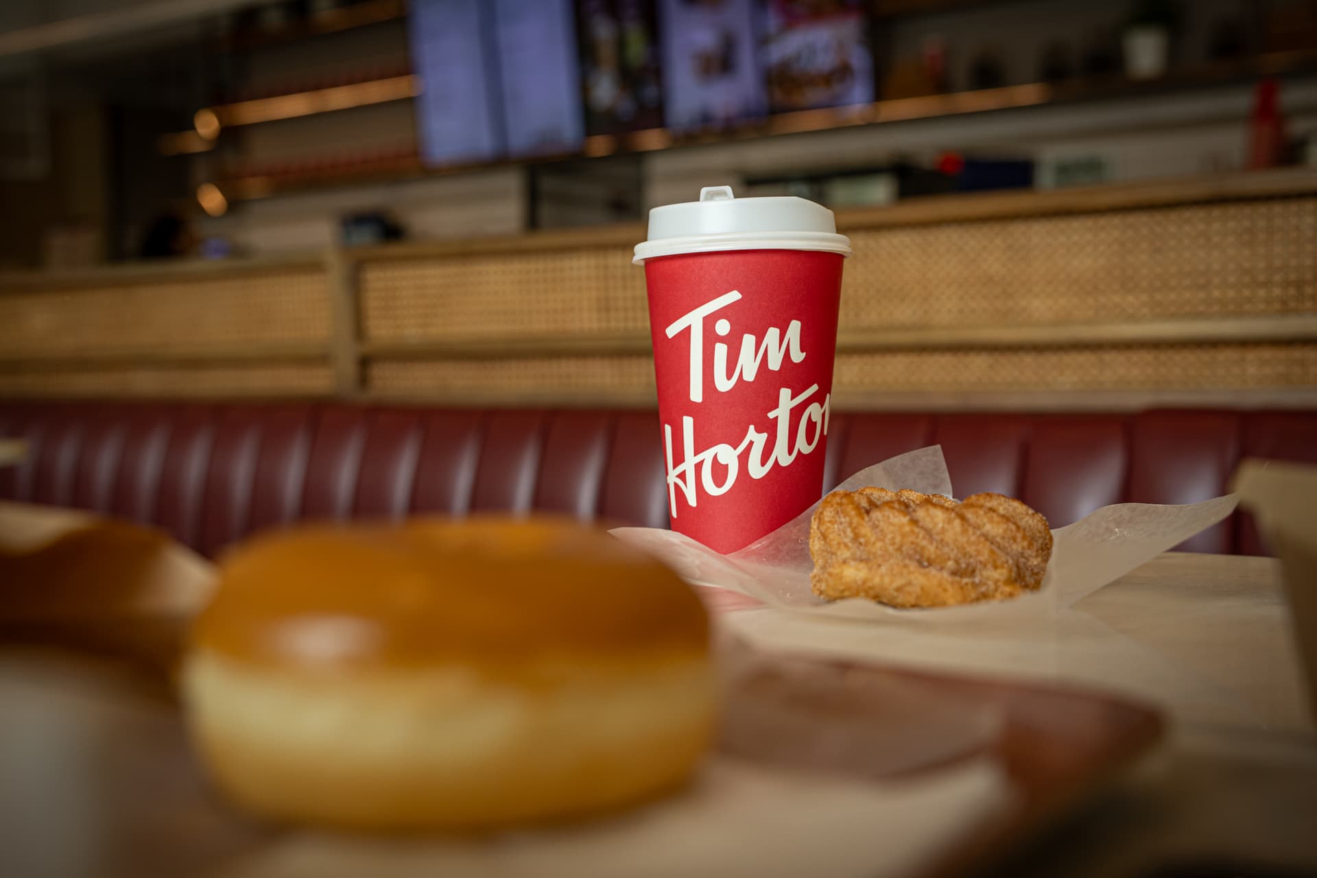 Lauren DeCicca/Getty Images A Tim Hortons coffee and doughnut on display.