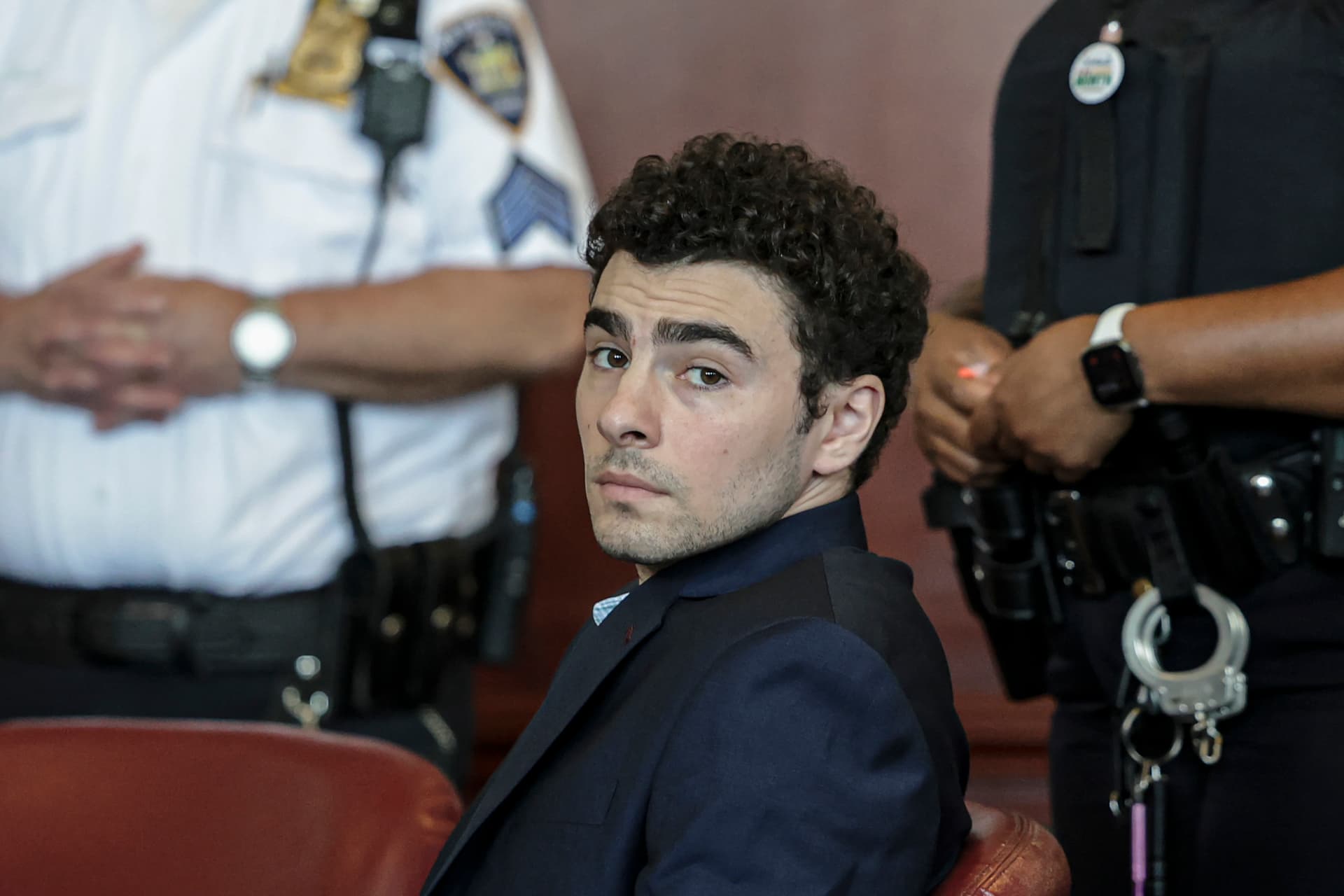 Jeenah Moon-Pool/Getty Images Luigi Mangione appears at an evidence suppression hearing at Manhattan Supreme Court on May 18, 2026, at New York City. Mangione is charged with murder in the fatal shooting of UnitedHealthcare CEO Brian Thompson at Manhattan in December 2024.