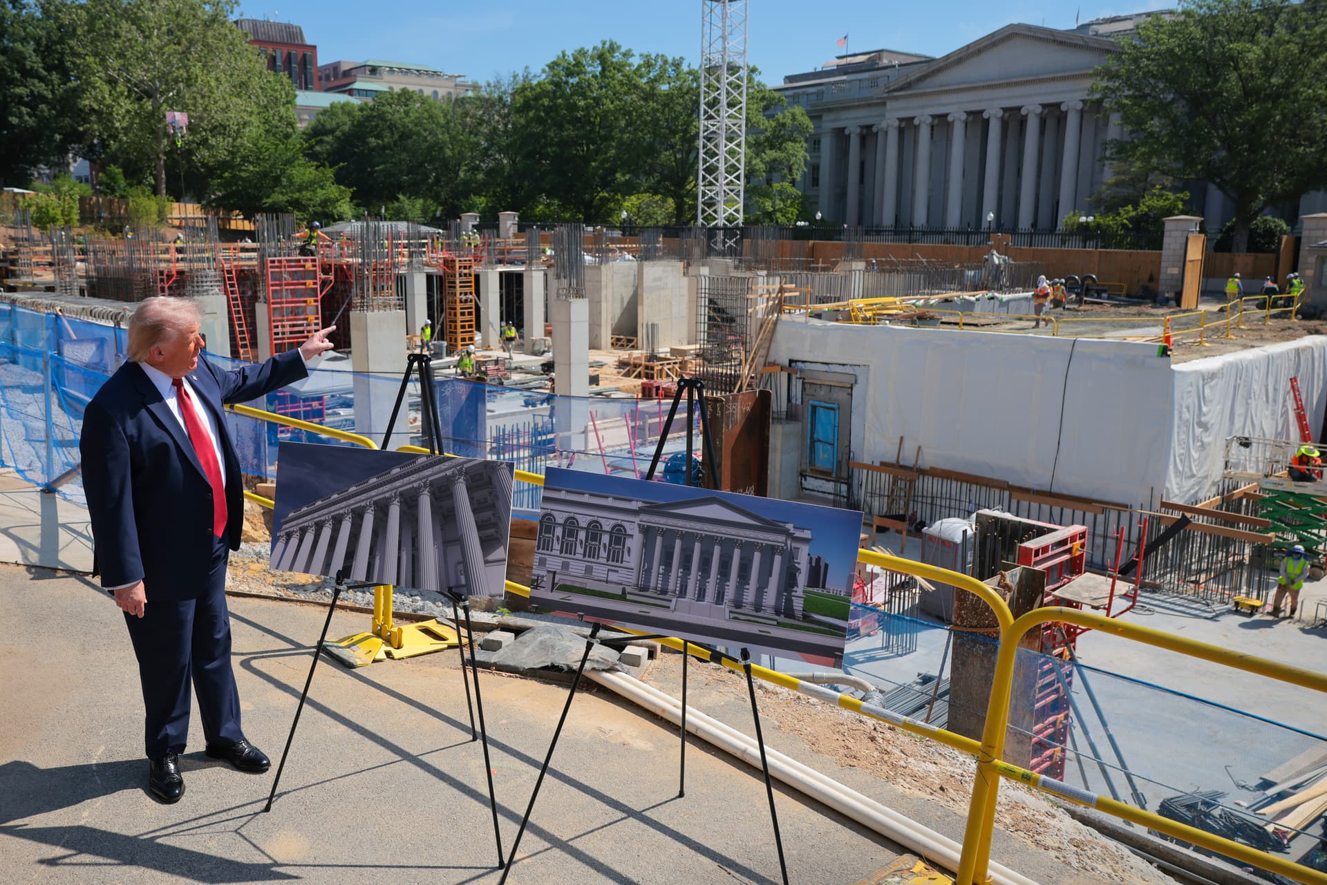 Photo by Chip Somodevilla/Getty Images President Trump speaks to the media alongside posters of his proposed White House ballroom amid construction at the White House on May 19, 2026, at Washington, D.C.