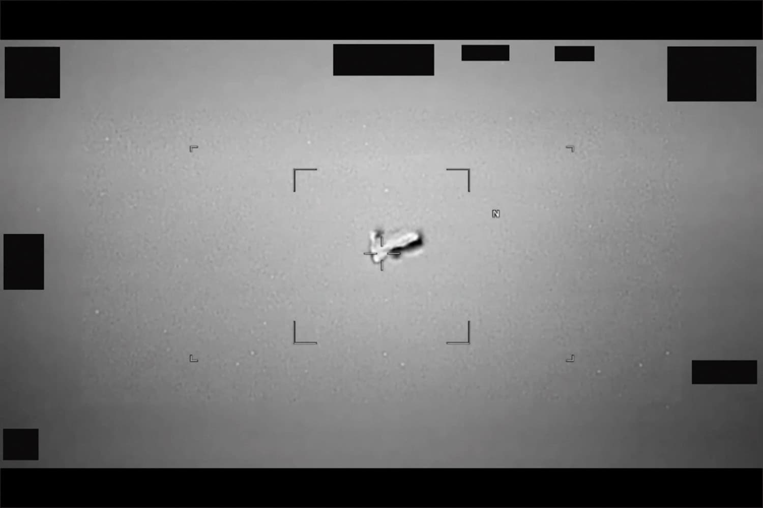 Defense Department via Getty Images This image of a football-shaped body, photographed near Japan by the U.S. Indo-Pacific Command, was included in a release of UAP materials by the Defense Department on May 8, 2026.
