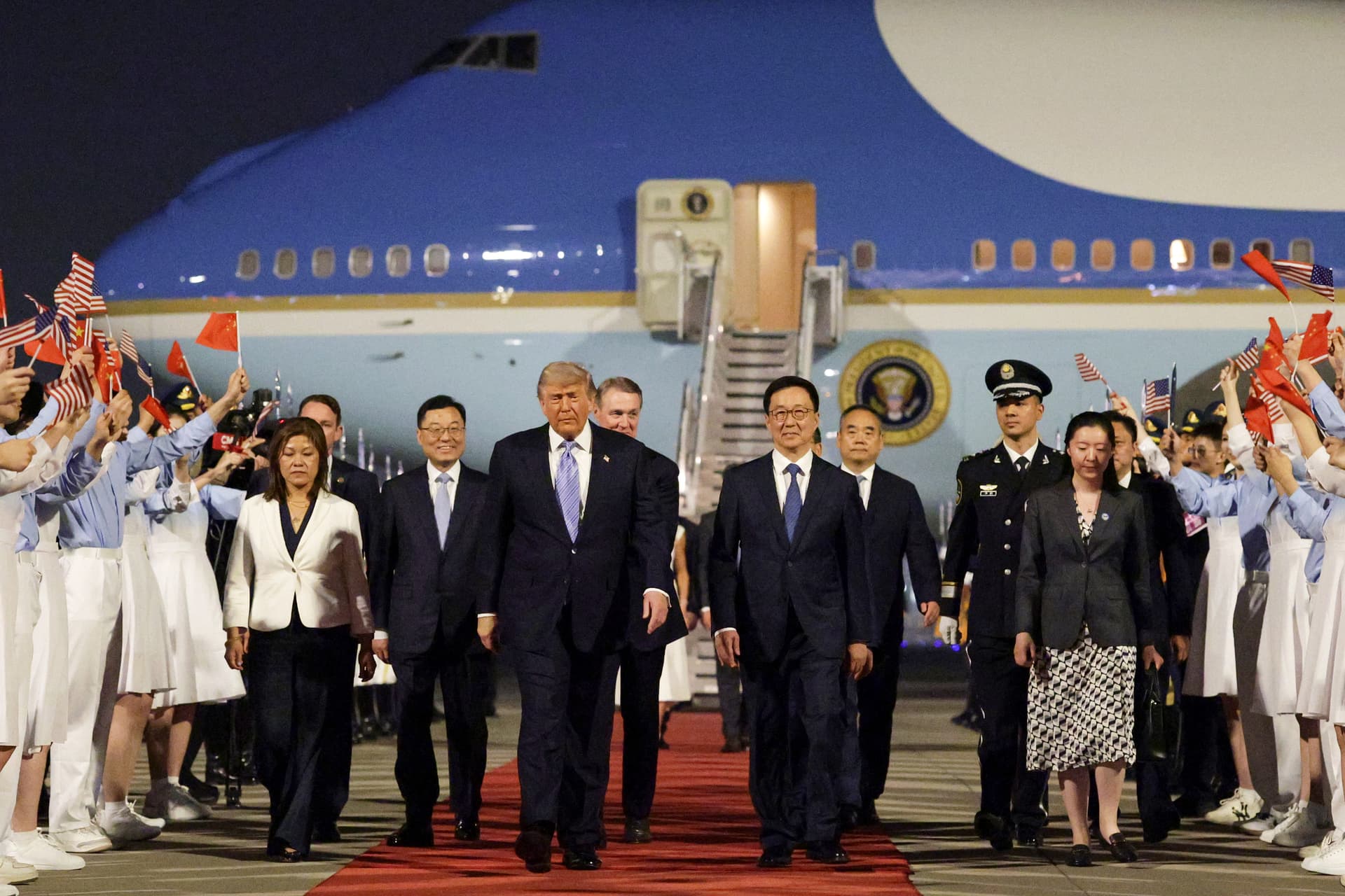 Alex Wong/Getty Images President Trump, joined by China's executive vice minister of foreign affairs, Ma Zhaoxu; America's ambassador to China, David Perdue; Vice President Han Zheng; and China's ambassador to America, Xie Feng, at Beijing's airport, May 13, 2026.