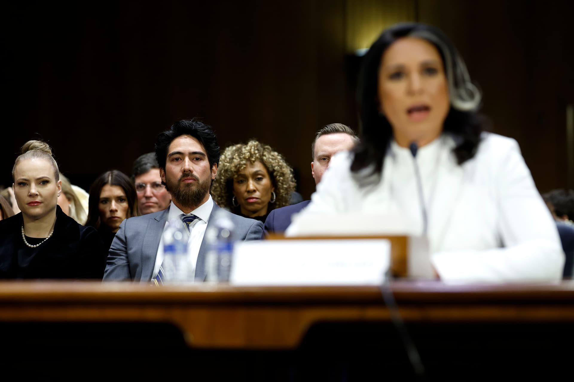 Kevin Dietsch/Getty Images Abraham Williams, husband of Tulsi Gabbard, looks on as she testifies during her confirmation hearing.