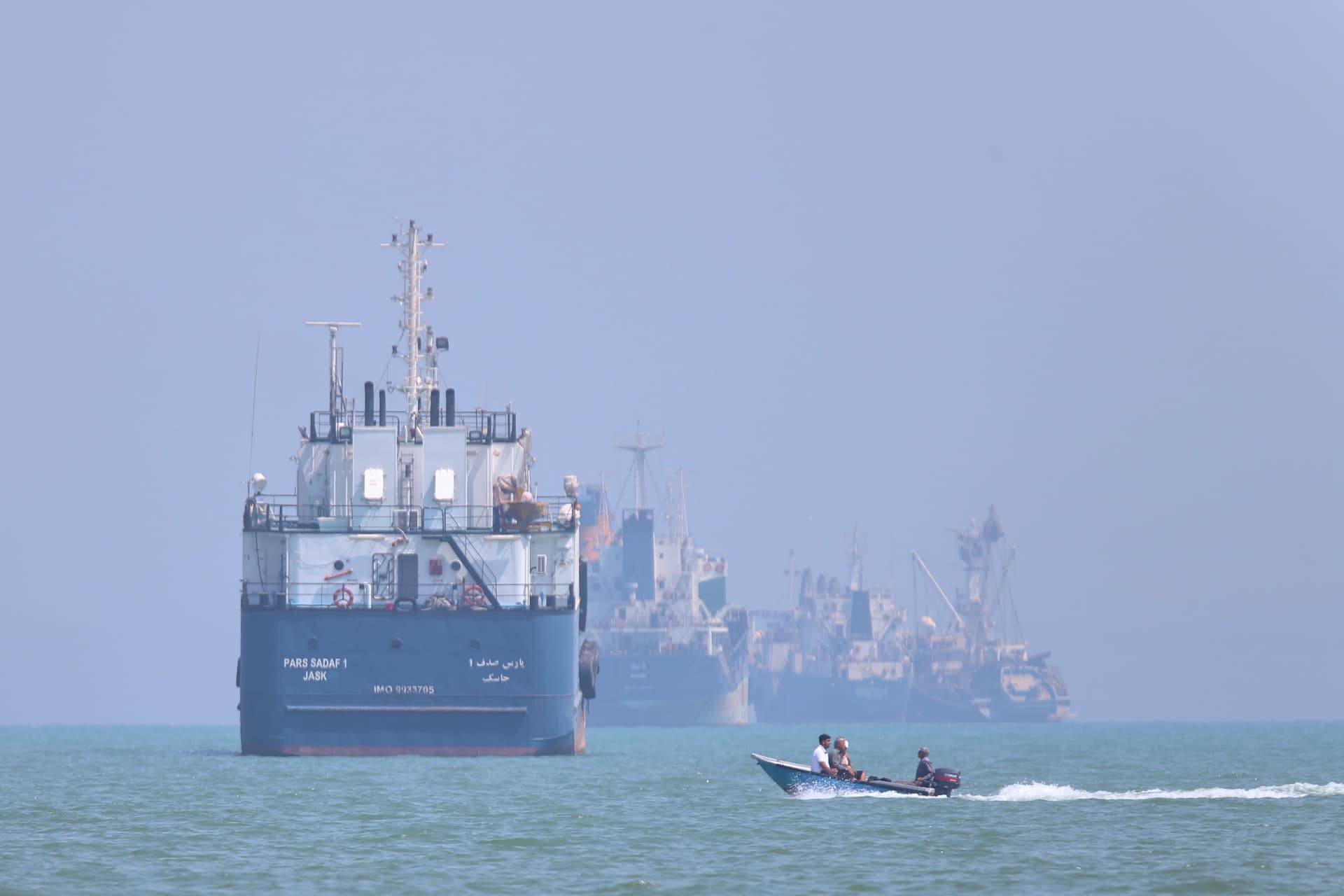 Amirhosein Khorgooi/ISNA via AP A small motorboat passes anchored vessels in the Strait of Hormuz off Bandar Abbas, Iran, on June 11, 2026.