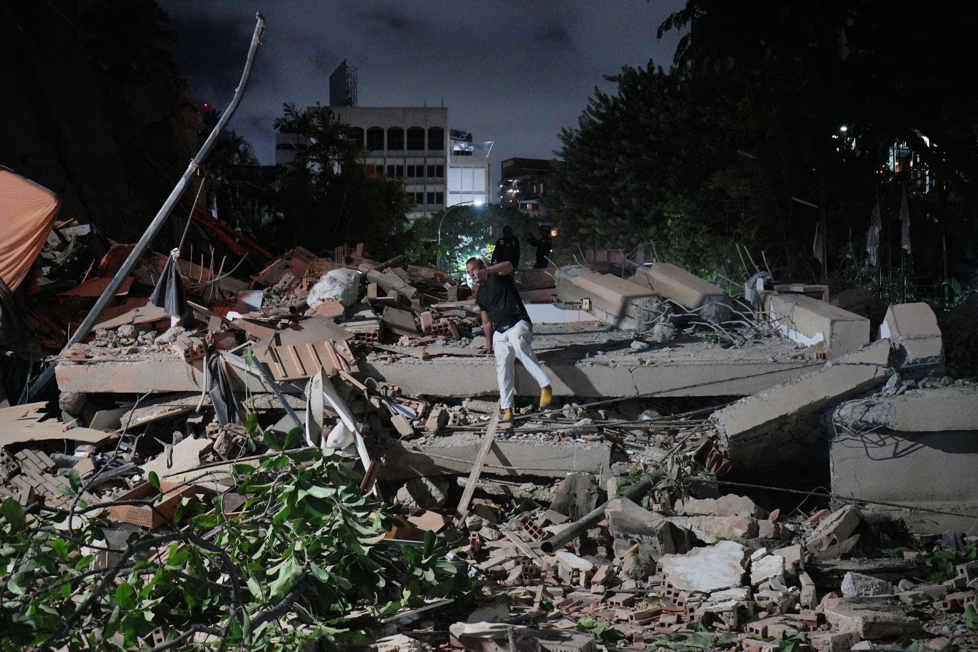 Ariana Cubillos/AP Rescue workers search for survivors at a collapsed building after an earthquake at Caracas, Venezuela, on June 24, 2026.