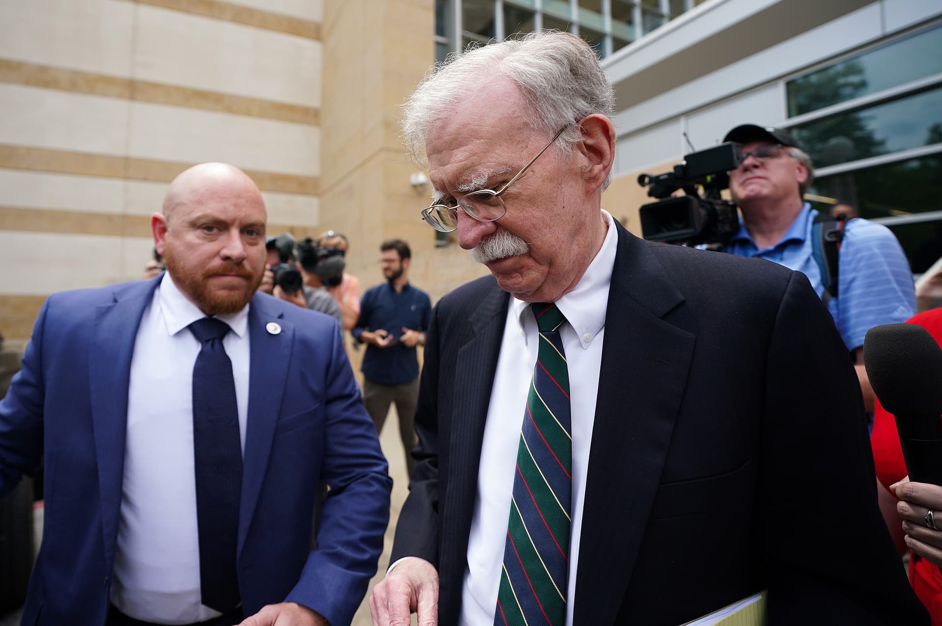 Al Drago/Getty Images A former national security adviser, John Bolton, departs United States District Court for the District of Maryland at Greenbelt, Maryland, after a plea deal hearing on June 26, 2026.