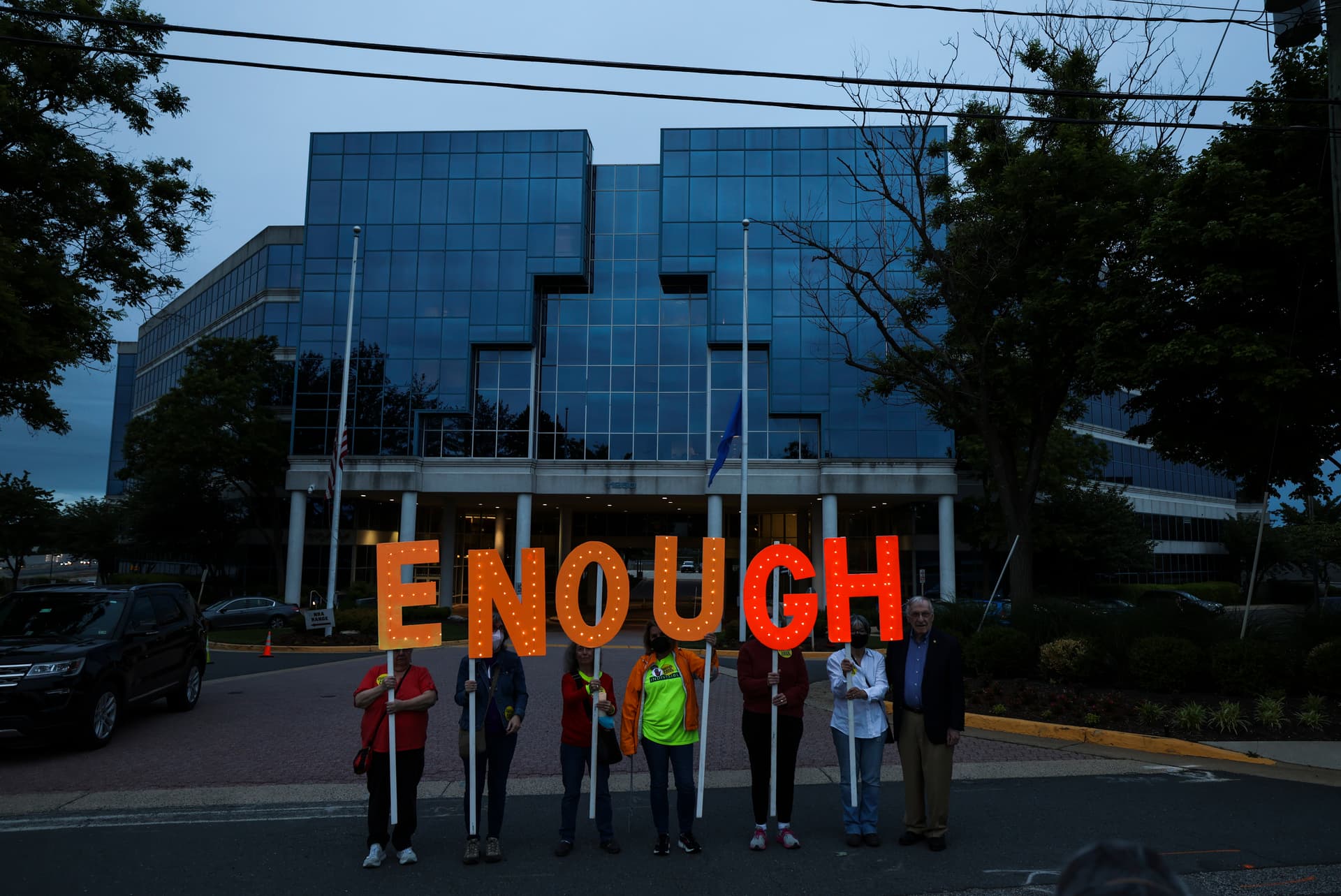 Kevin Dietsch/Getty Images Gun-control advocates hold a vigil outside of the National Rifle Association headquarters following a mass shooting at Robb Elementary School in Fairfax, Virginia, on May 25, 2022.