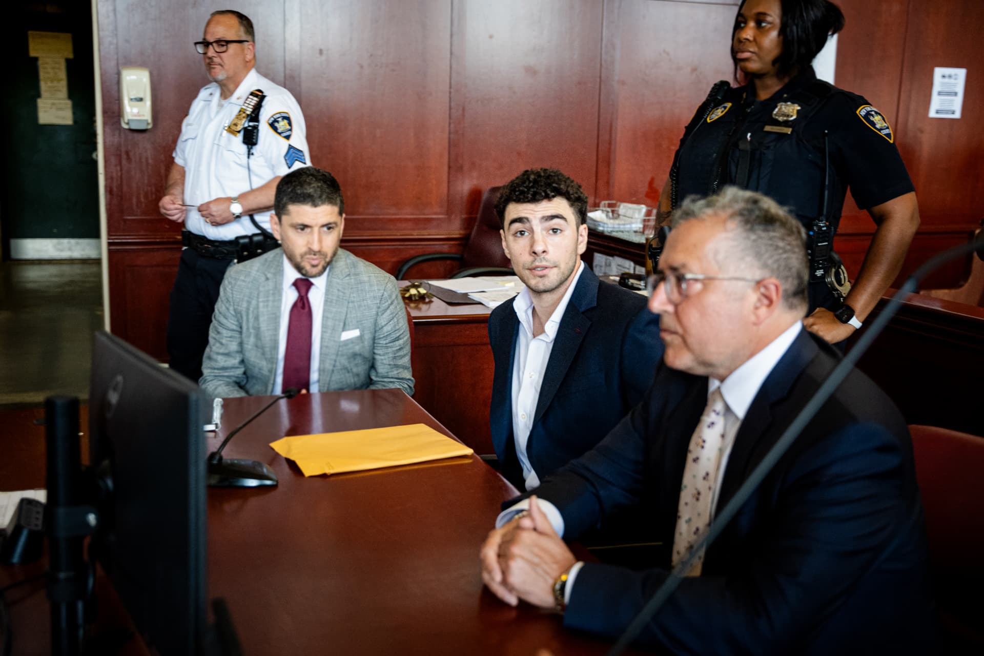 Angelina Katsanis-Pool/Getty Images Luigi Mangione appears with lawyers Jacob Kaplan and Marc Agnifilo at a hearing at Manhattan Criminal Court on June 17, 2026, at New York City. Mr. Mangione is charged with murder in the shooting of UnitedHealthcare CEO Brian Thompson at Manhattan in December 2024.