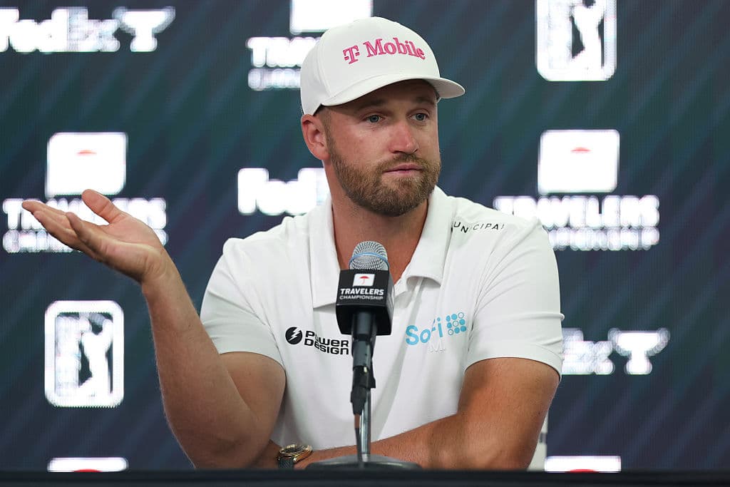 Jordan Bank/ Getty Images Wyndham Clark addresses the media prior to the Travelers Championship 2026 at TPC River Highlands in Cromwell, Connecticut.