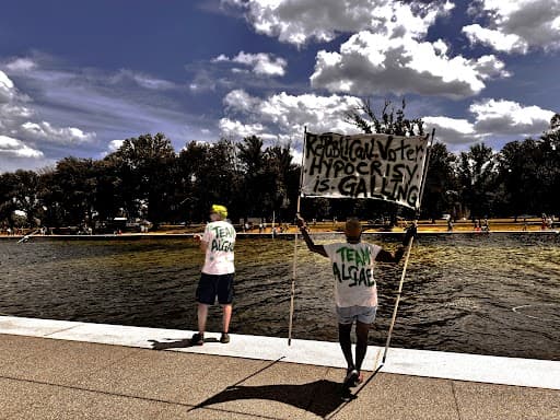Joseph Curl/The New York Sun Critics of President Trump’s restoration work at the Lincoln Memorial Reflecting Pool appeared to be celebrating problems with the project, including peeling paint and a persistent algae bloom, on June 19, 2026.