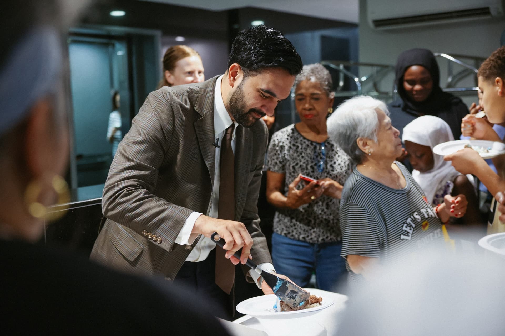Zohran Mamdani via X New York City Mayor Zohran Mamdani celebrates a rent freeze on landlords with an ice cream cake for tenants of Lenox Hill Terrace at East Harlem, June 26, 2026.