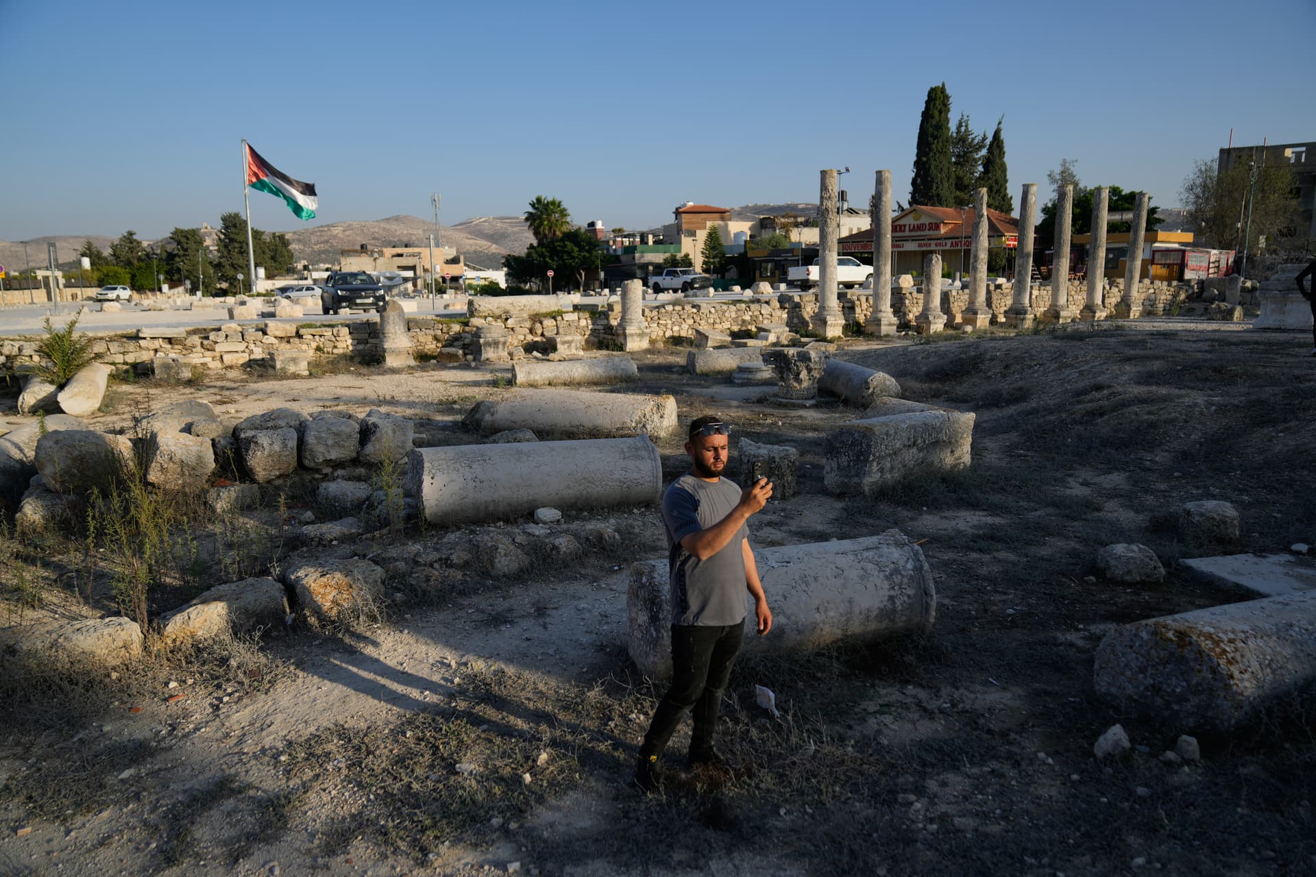 Nasser Nasser/AP A Palestinian visitor takes a photo at the West Bank historical site of Sebastia, considered to be the ancient capital of Northern Israel, Samaria on November 20, 2025.