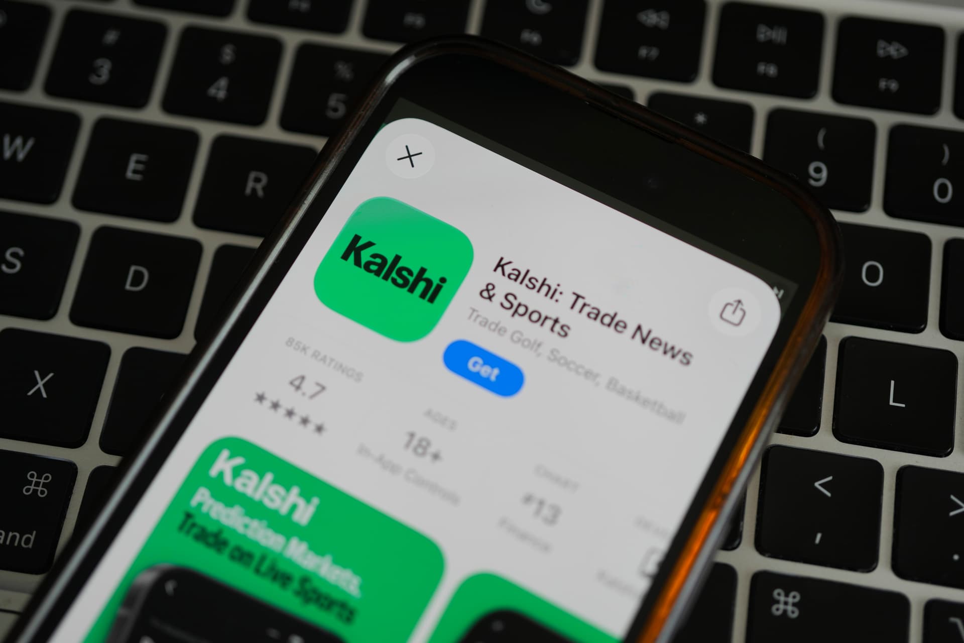 Erin Hooley/AP An ad for the prediction market app Kalshi is displayed on a mobile phone at Chicago on April 16, 2026.