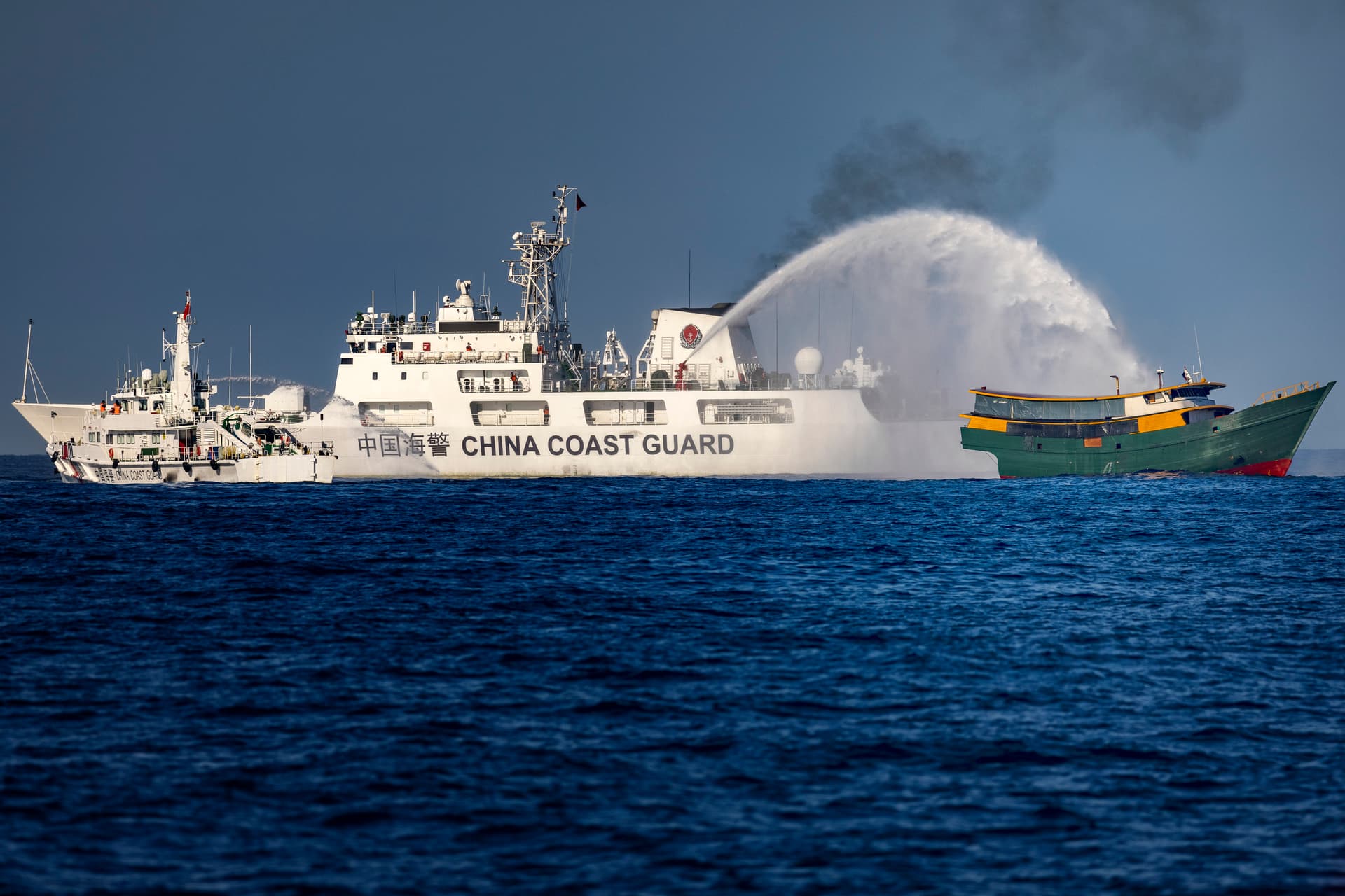 Ezra Acayan/Getty Images A Chinese Coast Guard ship fires a water cannon at a Philippine Navy chartered vessel on a resupply mission to troops stationed at Second Thomas Shoal in the South China Sea on March 5, 2024.