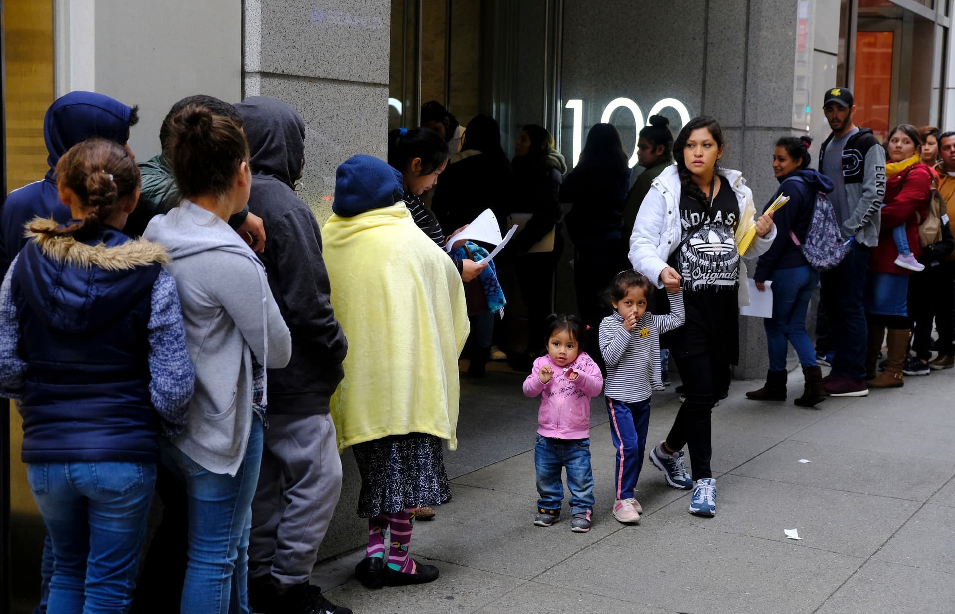 Eric Risberg/AP Prospective immigrants stand in line outside a United States immigration office with numerous courtrooms at San Francisco on January 31, 2019.