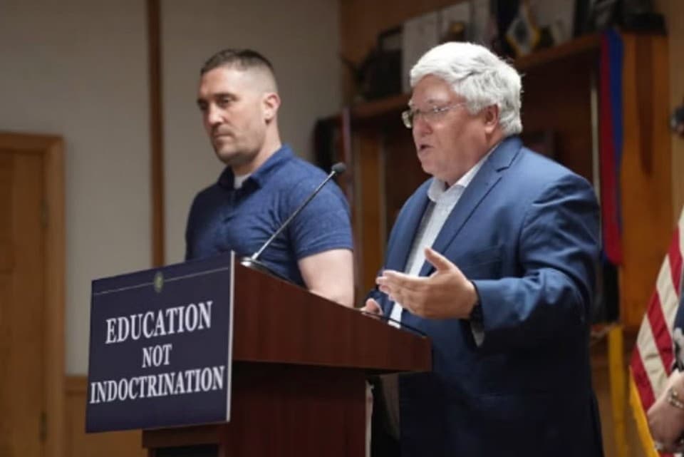 West Virginia Governor’s Office via X West Virginia’s governor, Patrick Morrisey, appears with the state’s House of Delegates majority leader, Pat McGeehan, at the ceremonial signing of a bill creating a new civics center at Chester, West Virginia, on June 26, 2025.