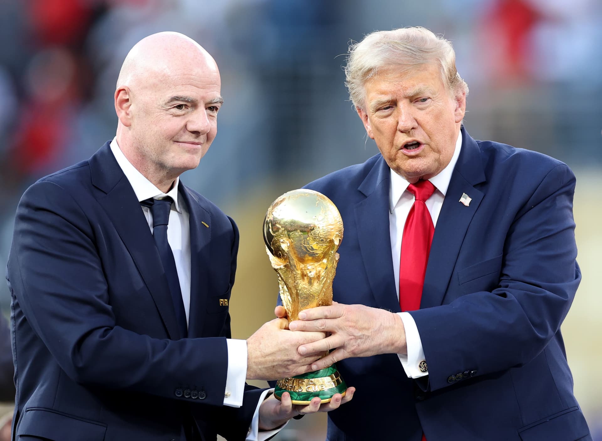Dan Mullan/Getty Images President Trump and FIFA's president, Gianni Infantino, hold the FIFA World Cup Winner's Trophy on July 19, 2026.