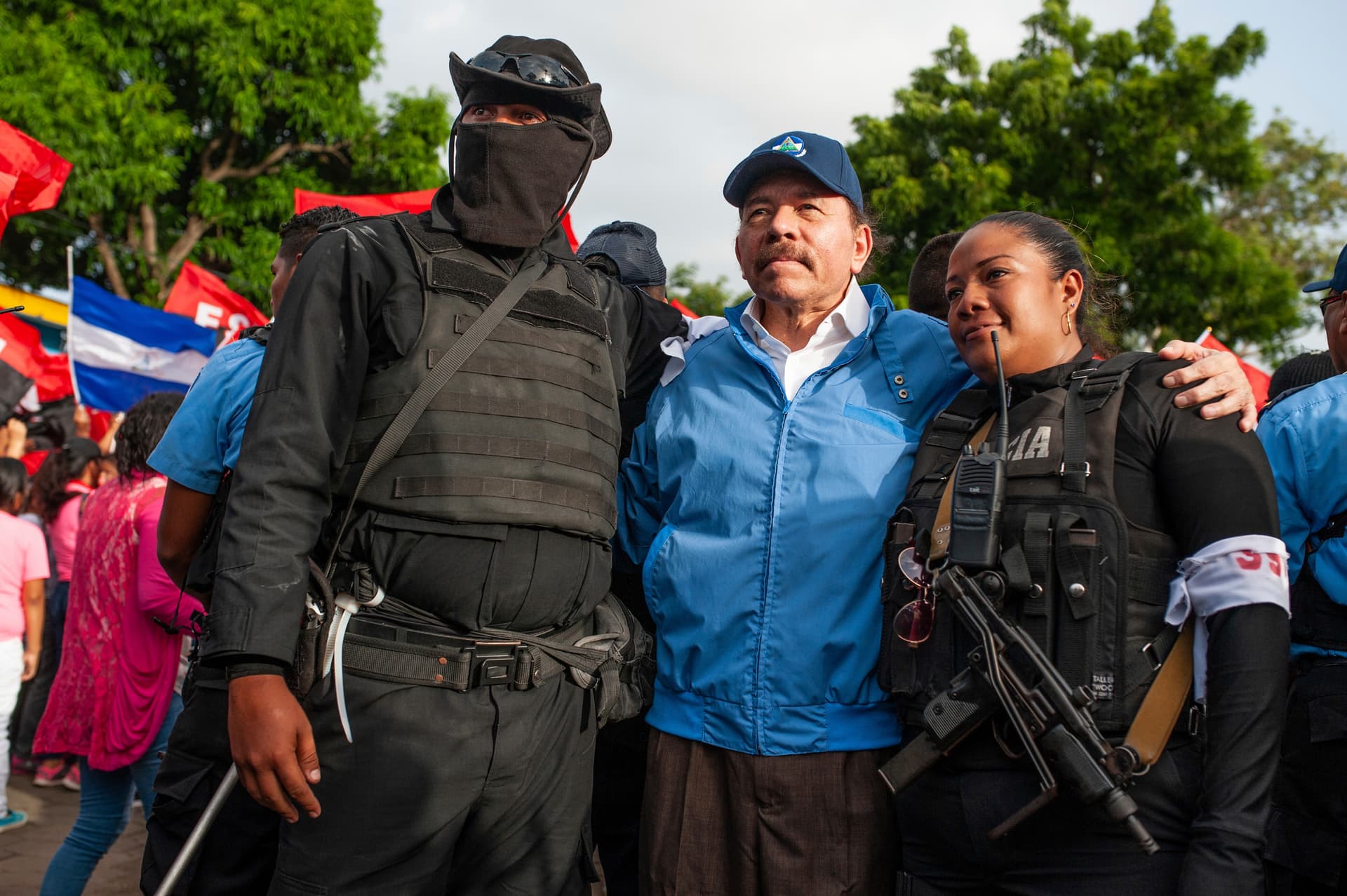 AP/Cristobal Venegas President Daniel Ortega, center, with police officers at Masaya, Nicaragua, on July 13, 2018.