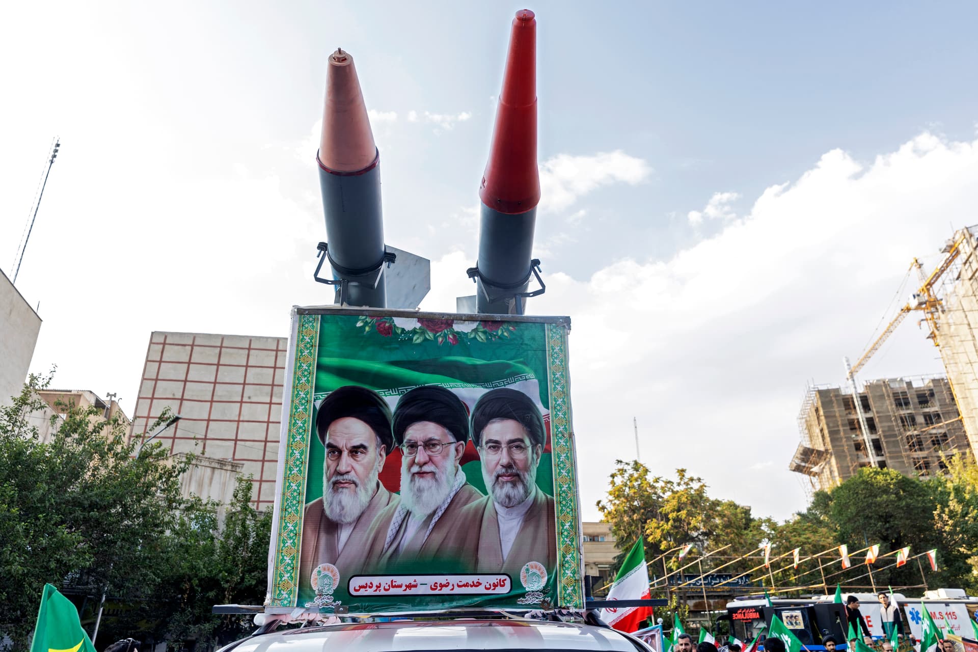 Getty Images A car with replicas of missiles and an image of Iran's top leaders is seen during a gathering to commemorate the death of historic religious figure Imam Reza at Tehran on August 12, 2026.