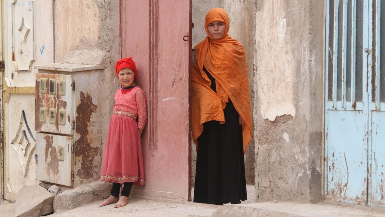 Voice of America Somaya, right, who was sold into marriage at age 13, is seen at Herat, Afghanistan, in July 2019.