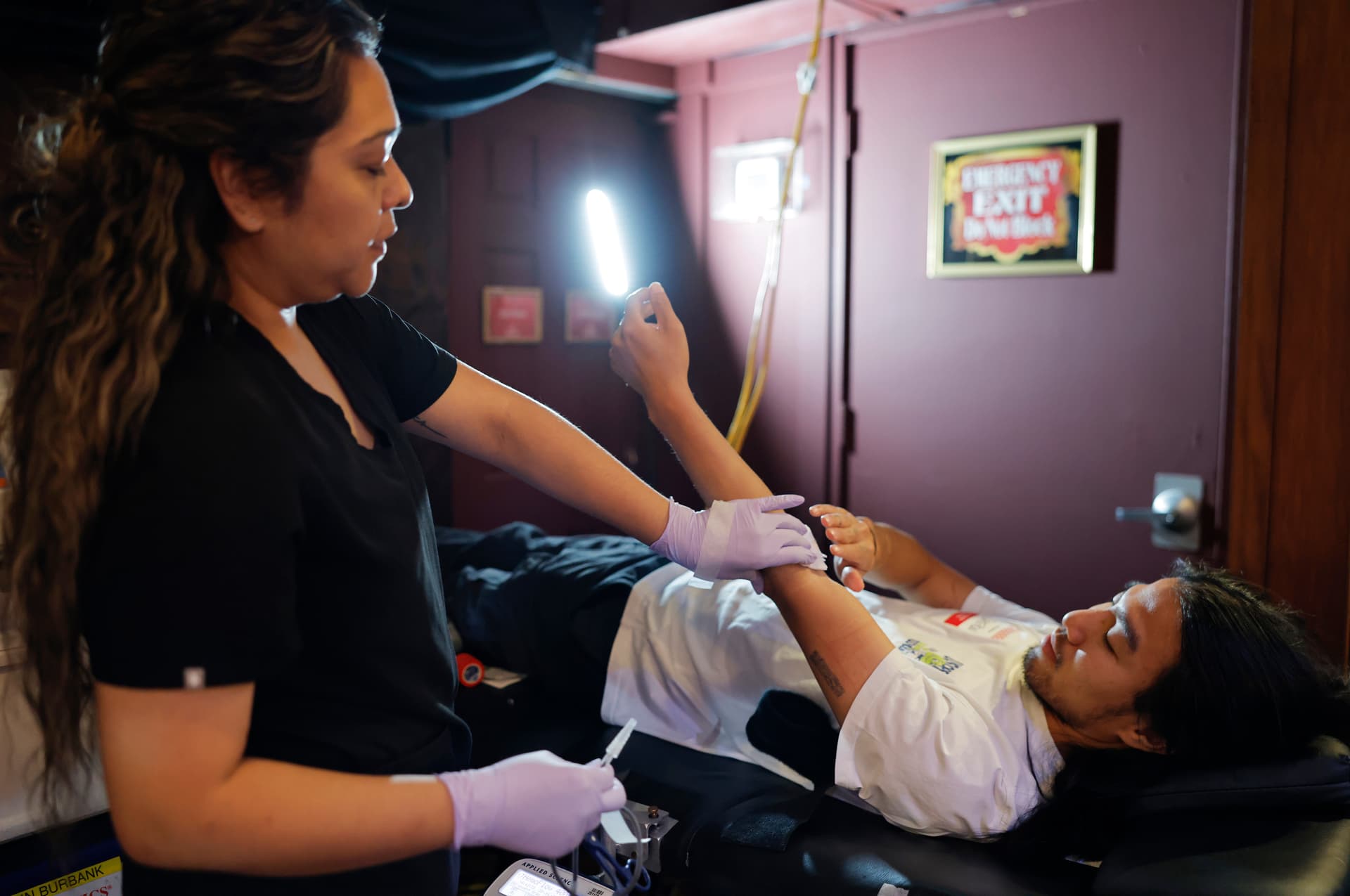 Mario Tama/Getty Images A clinician assists a blood donor during an American Red Cross blood drive at Hollywood's Magic Castle at Los Angeles, California, on July 28, 2026.