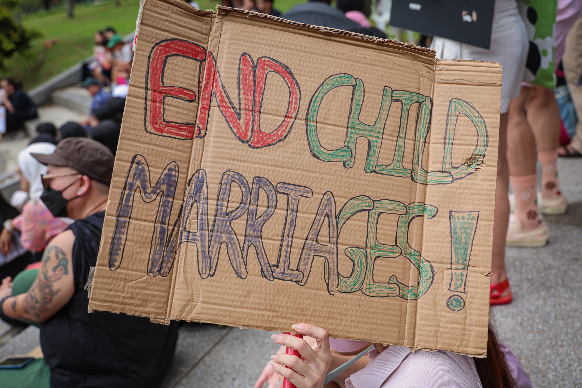 Annice Lyn/Getty Images A demonstrator holds a placard opposing child marriage during a Women's March gathering at Petaling Jaya, Malaysia, on March 8, 2025.
