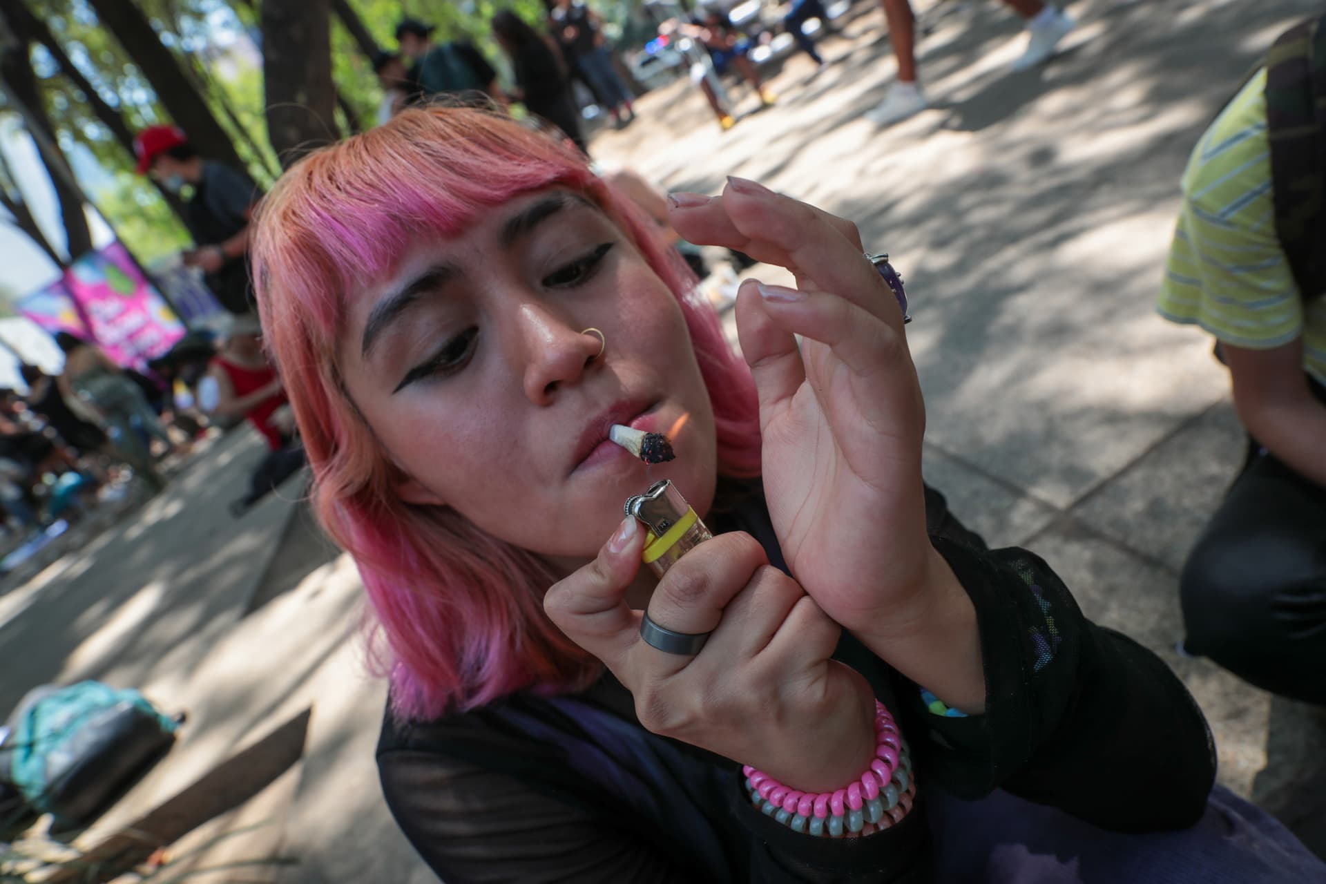Eduardo Mejia/Agencia Press South/Getty Images A woman smokes cannabis during 4/20 cannabis day celebrations.