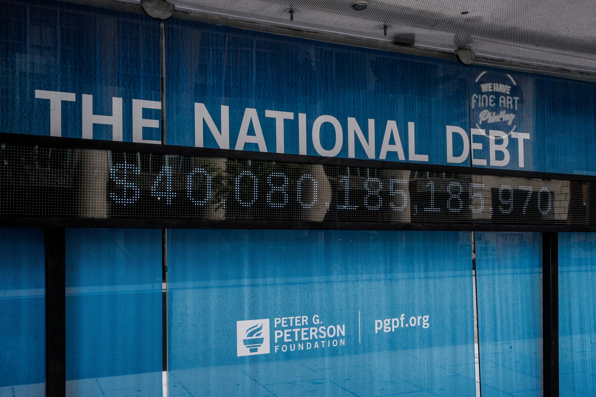 Jemal Countess/Getty Images An electronic billboard displays the current U.S. national debt.