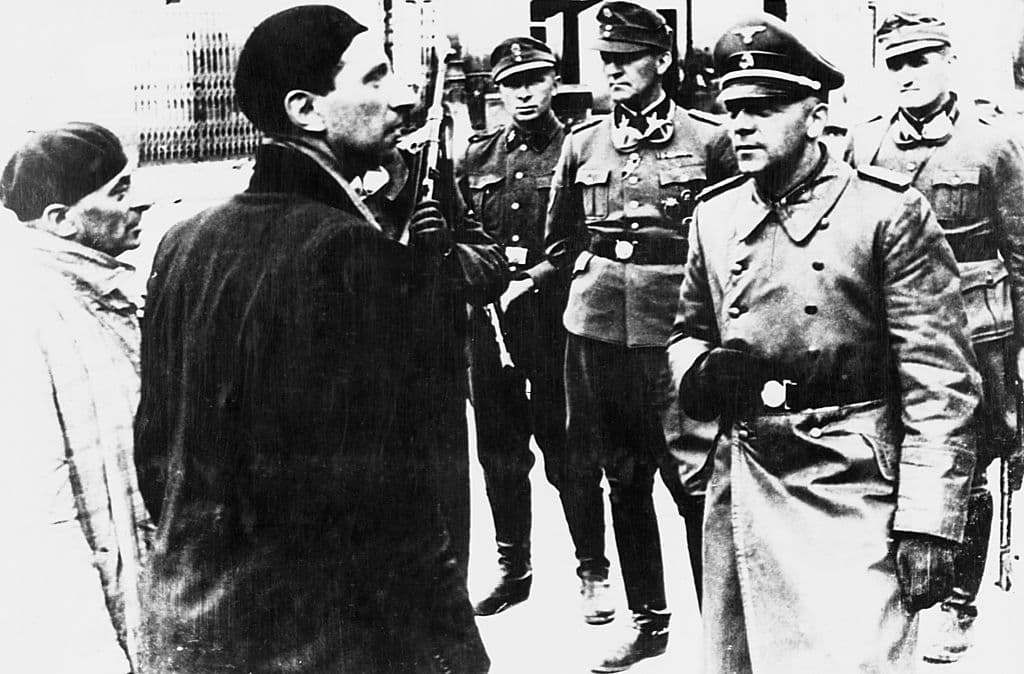 Corbis via Getty Images SS General Jürgen Stroop interrogates Jews during the destruction of the Warsaw Ghetto, 1943.